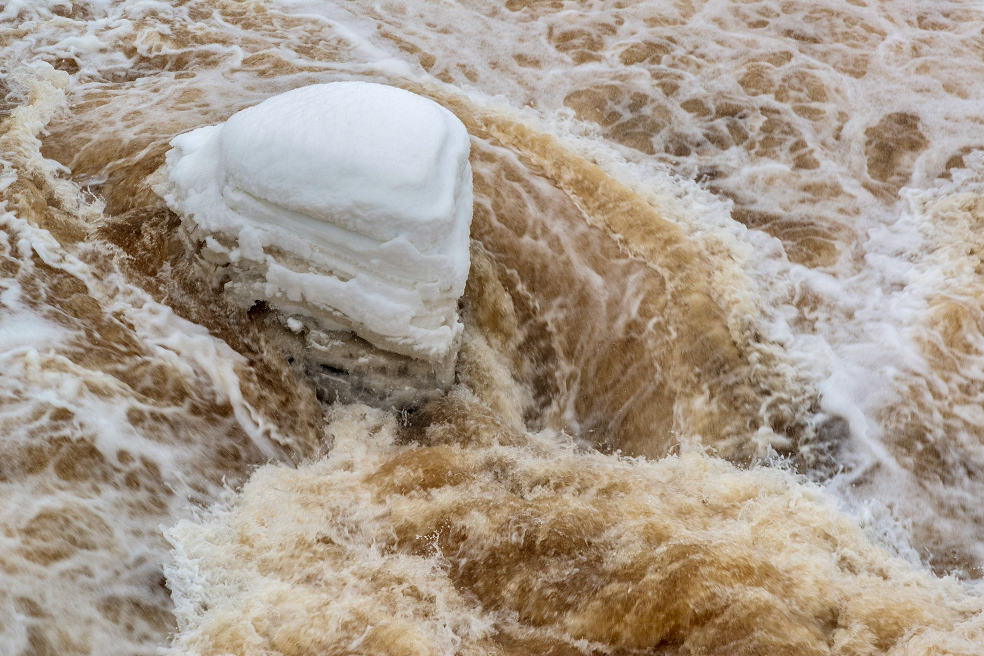 A detail shot of the river, looking back from the first bridge.