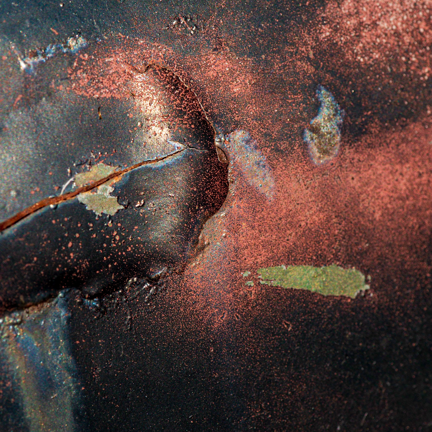 Rust, traces of paint, and blistering of metal. There’s a feeling of upward movement by the blister of metal and a violent confrontation underway.