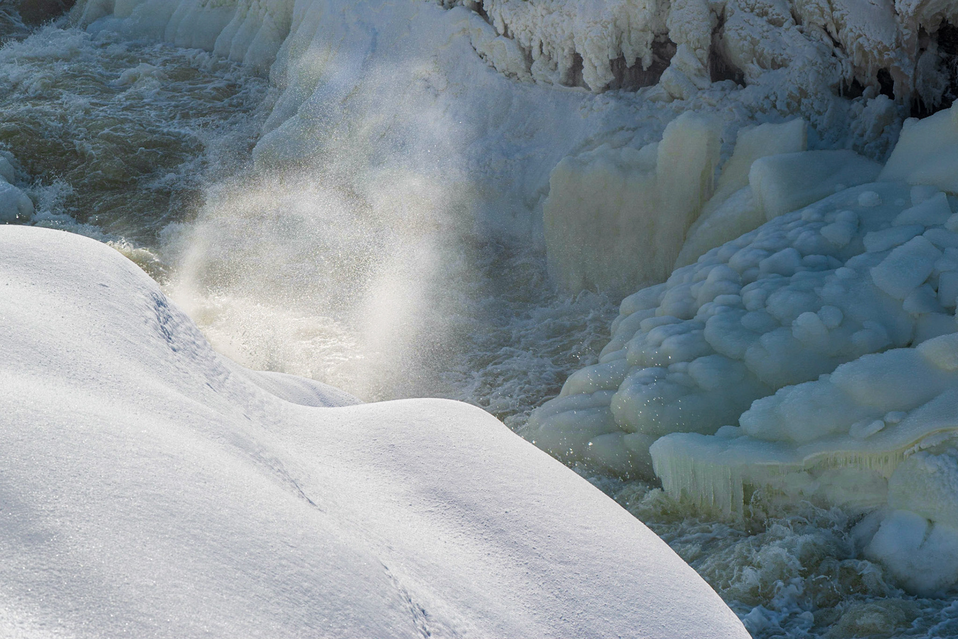 I noticed that the spray of water caught the light. So I took several shots seeking the most attractive spray. The energy of the spray is set against the calm blue of the background.