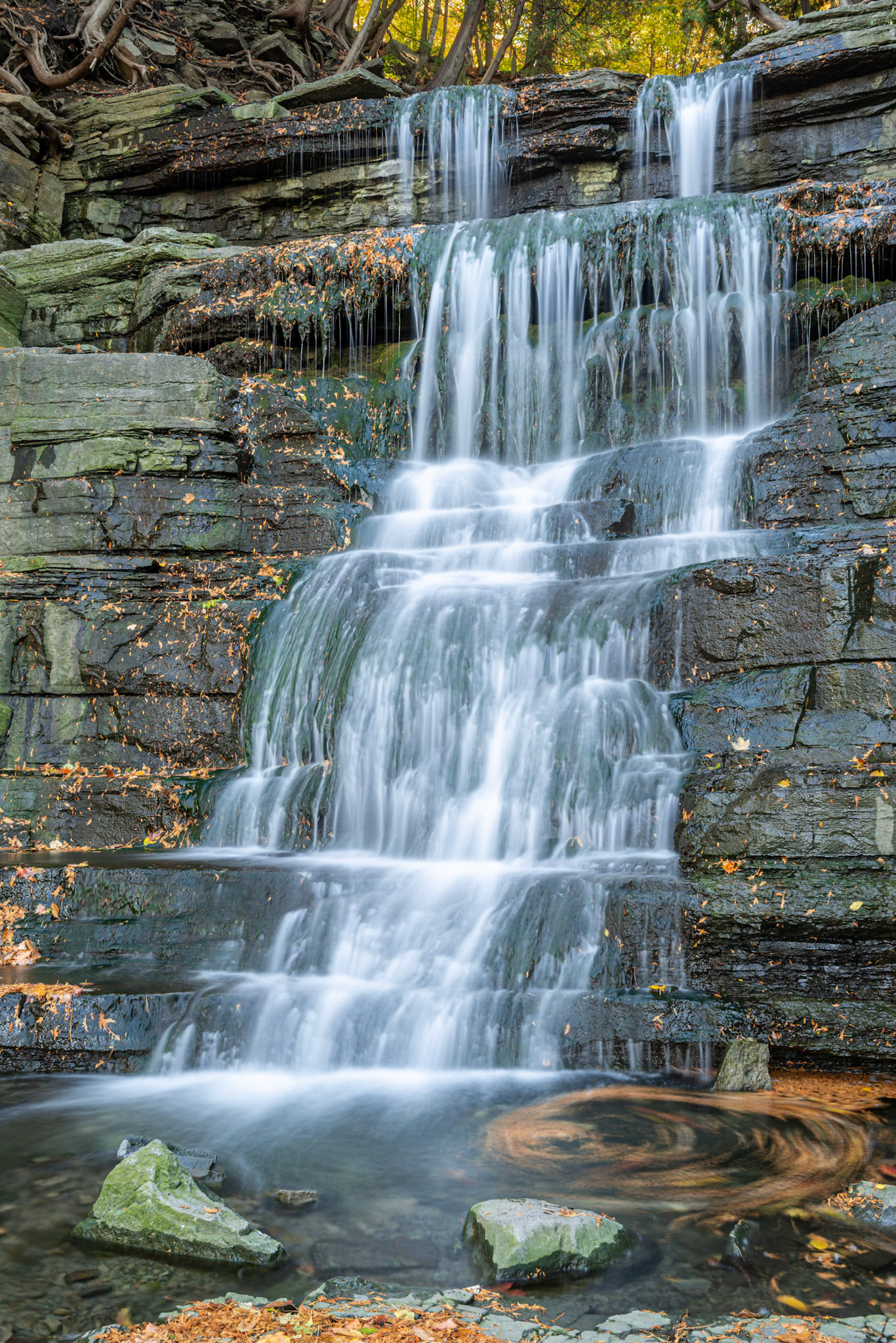 This is a wide angle shot taken at the base of the falls. I didn't notice that the water was circulating in the pool, but the 4 second exposure  makes this visible.