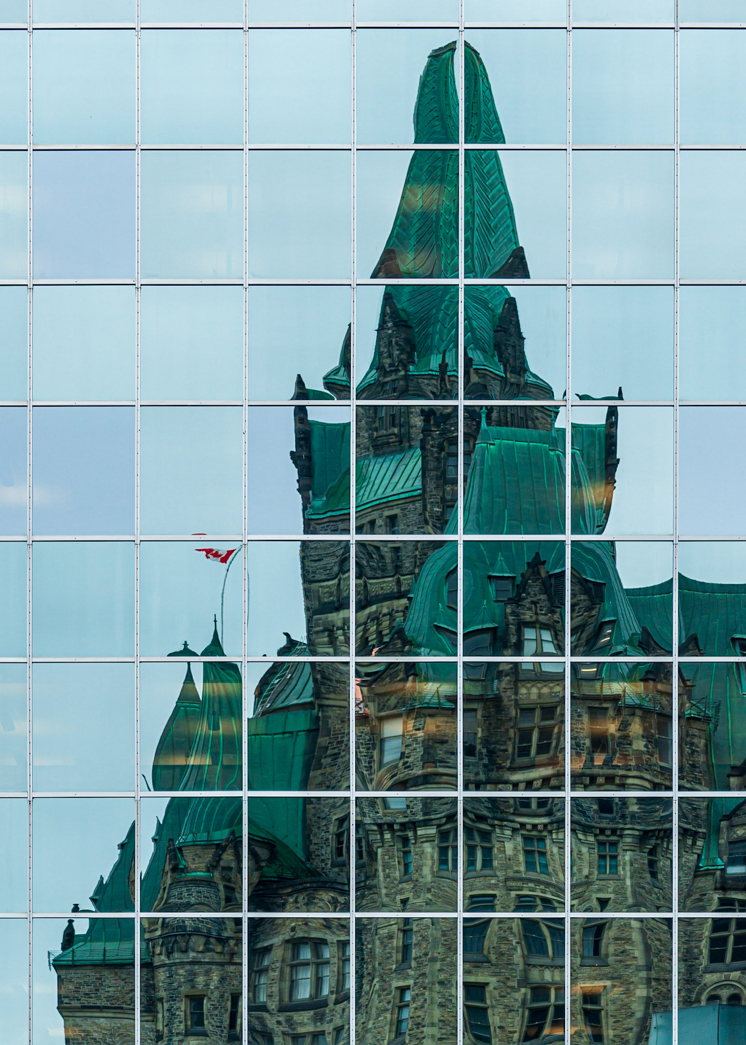 A fun house view of part of the parliament building. I particularly like the position of the Canadian flag in this shot, as a spot of red in an otherwise blue/green image.