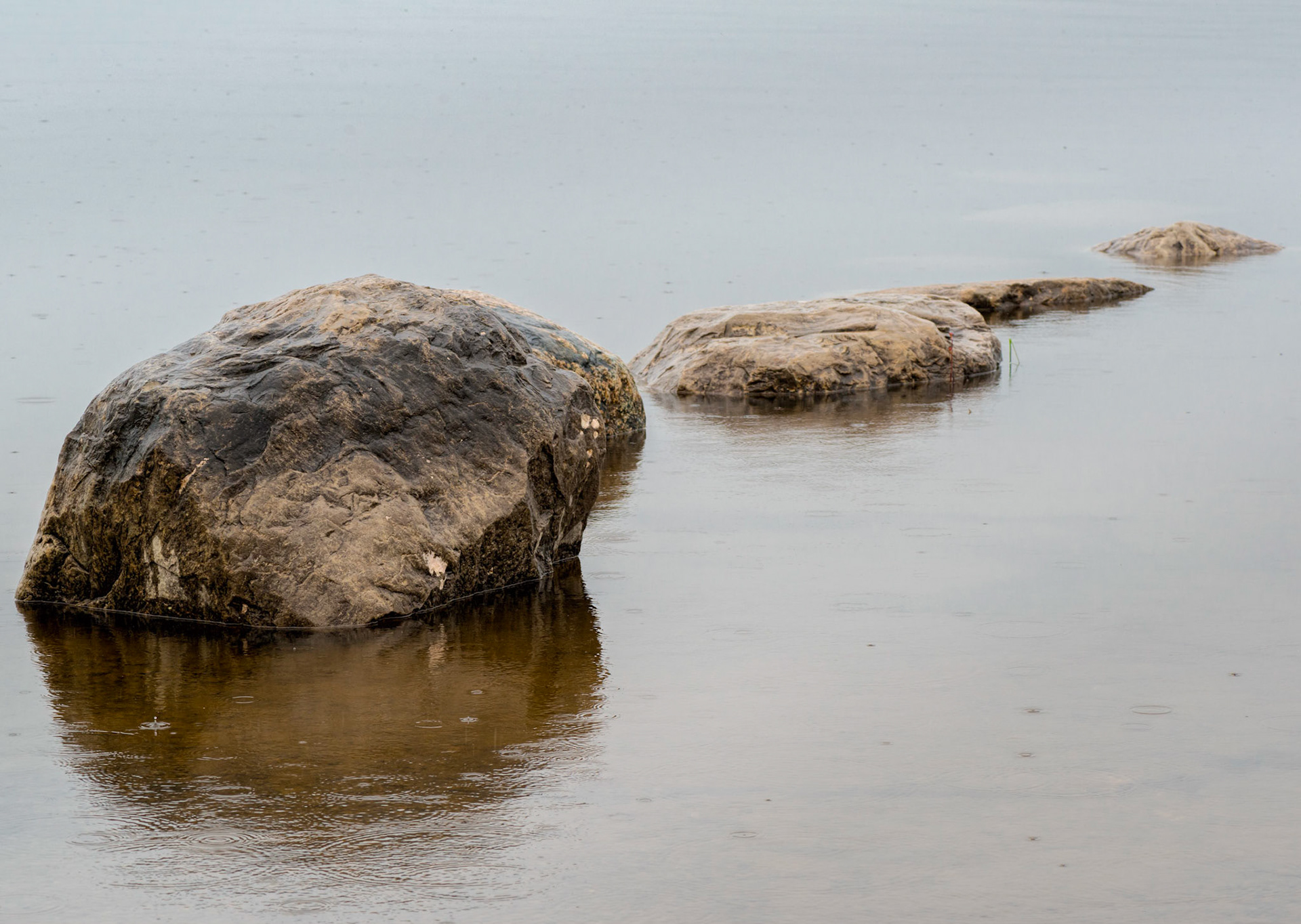 Odd numbers, and particularly threes, are very aesthetically pleasing, and here I've arranged three rocks along a diagonal in an otherwise empty scene to give them additional strength.