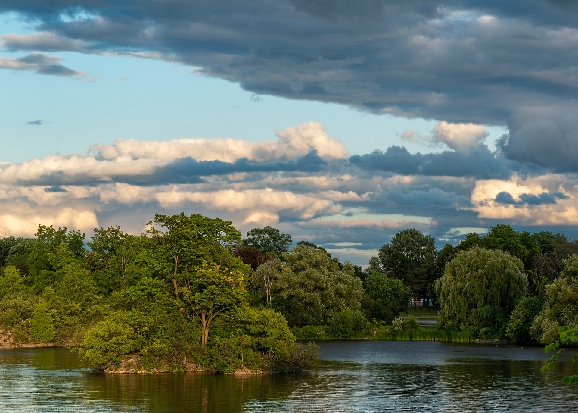 Beautiful light on a peaceful scene. I was seeking balance between the nicely lit island and the bank of clouds at the upper right.