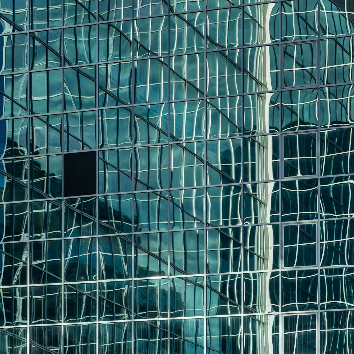 I initially thought the missing window pane was a problem with this shot of one building reflecting another, but then realized that by breaking the pattern it offered a centre of interest.