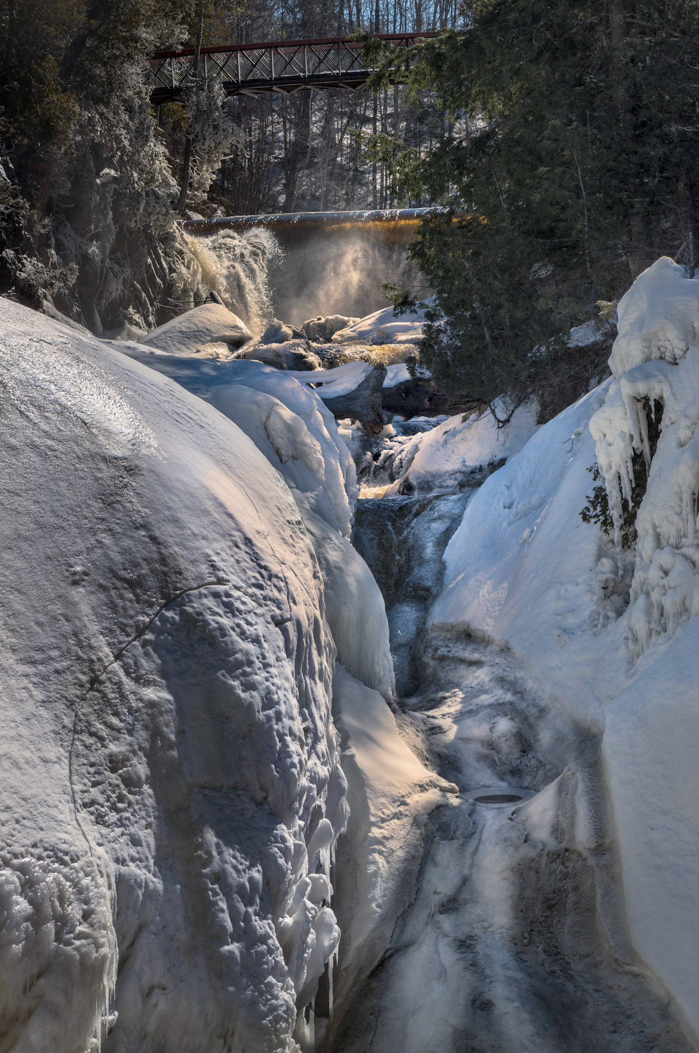 This secondary flow at Coulonge was frozen during our visit. The barrier over which the water flows and a footbridge are shown in the background.