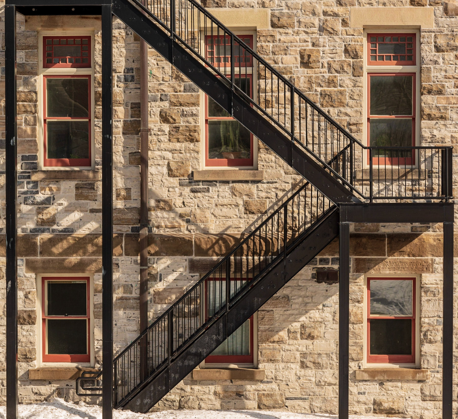 It's just the side of a building, but the symmetry of the windows and the diagonals expressed by the fire escape were appealing to my eye.