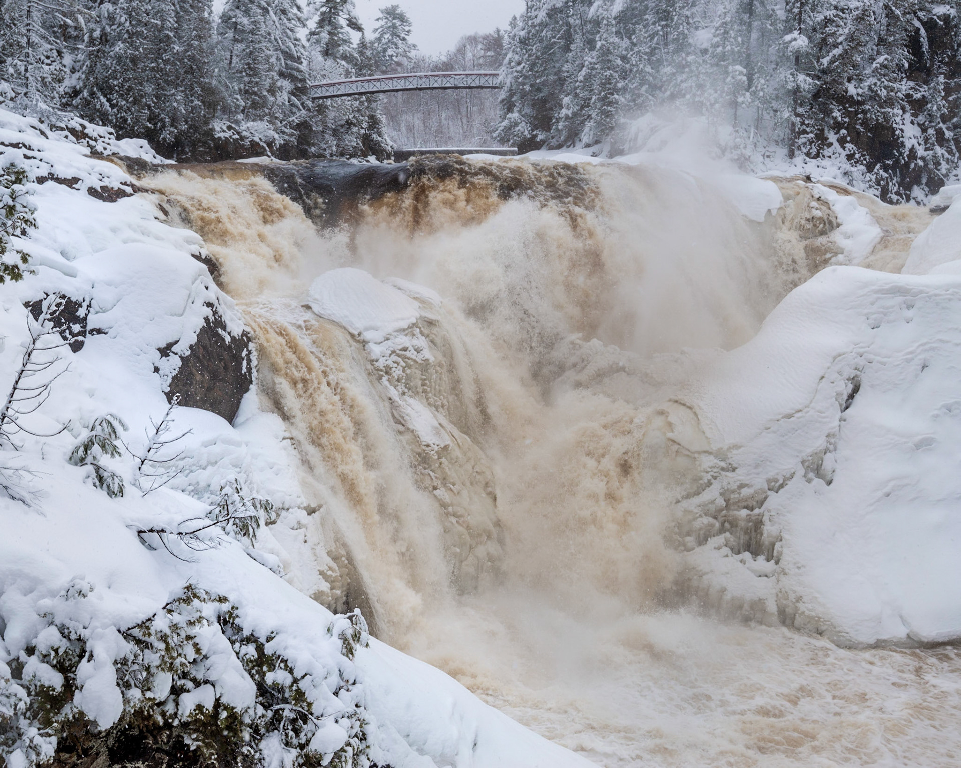 A closer view of the waterfall and the first walkway bridge.