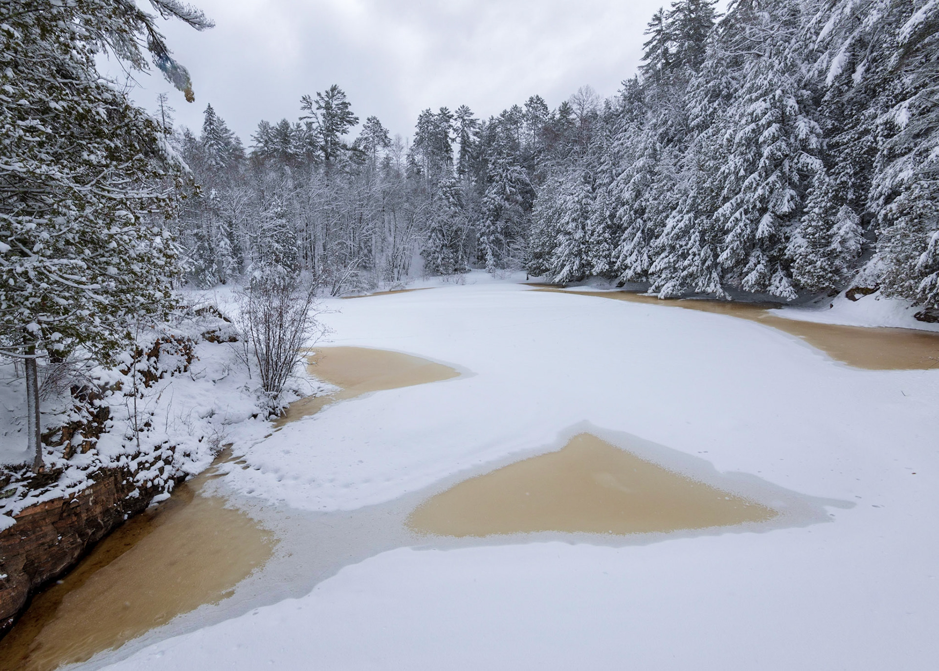 Behind the second bridge was a wonderful winter scene. I was particularly intrigued with the pattern of bare patches on the ice-covered lake, and chose my composition accordingly.