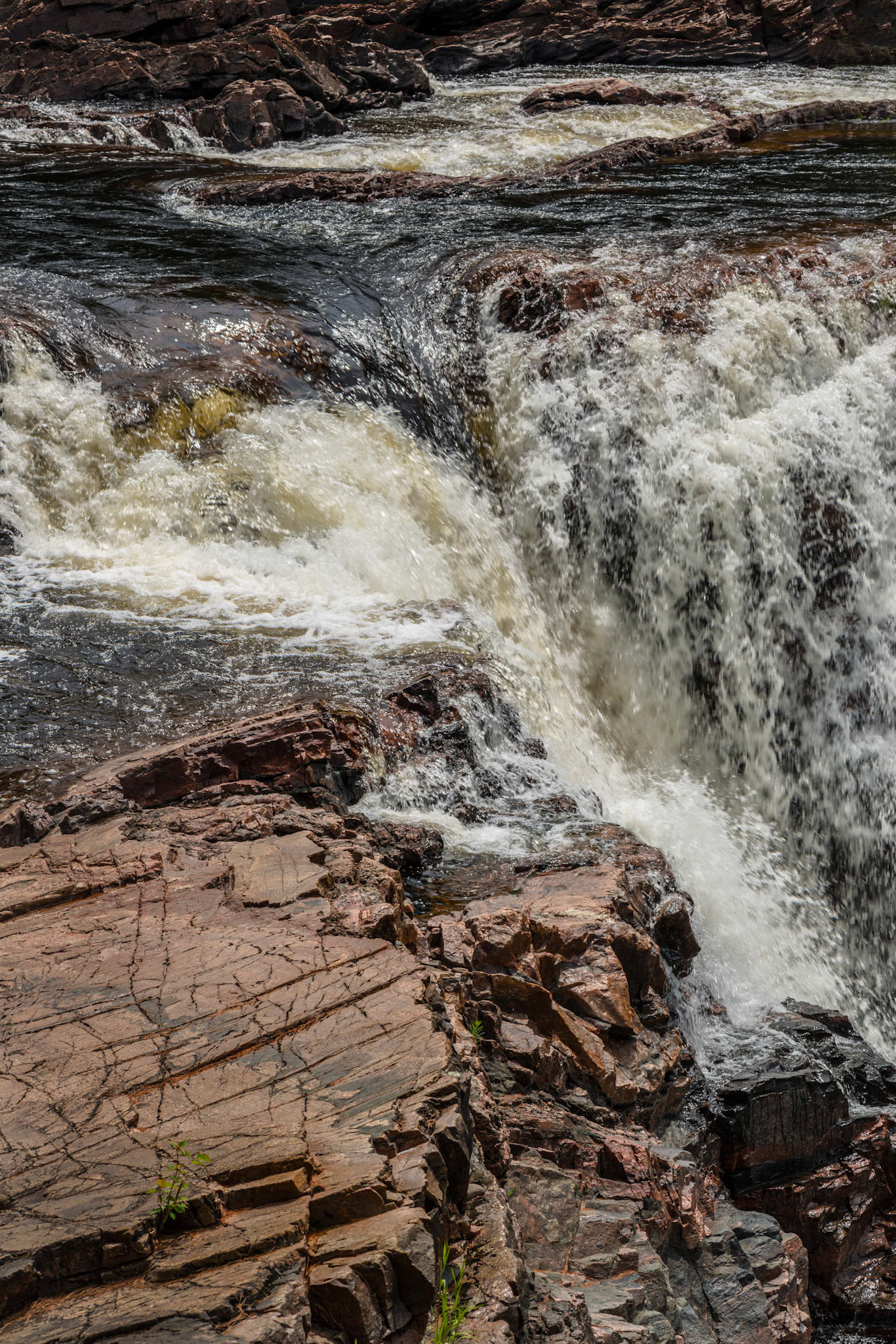 Water pours into the gorge through several channels, including this natural funnel.