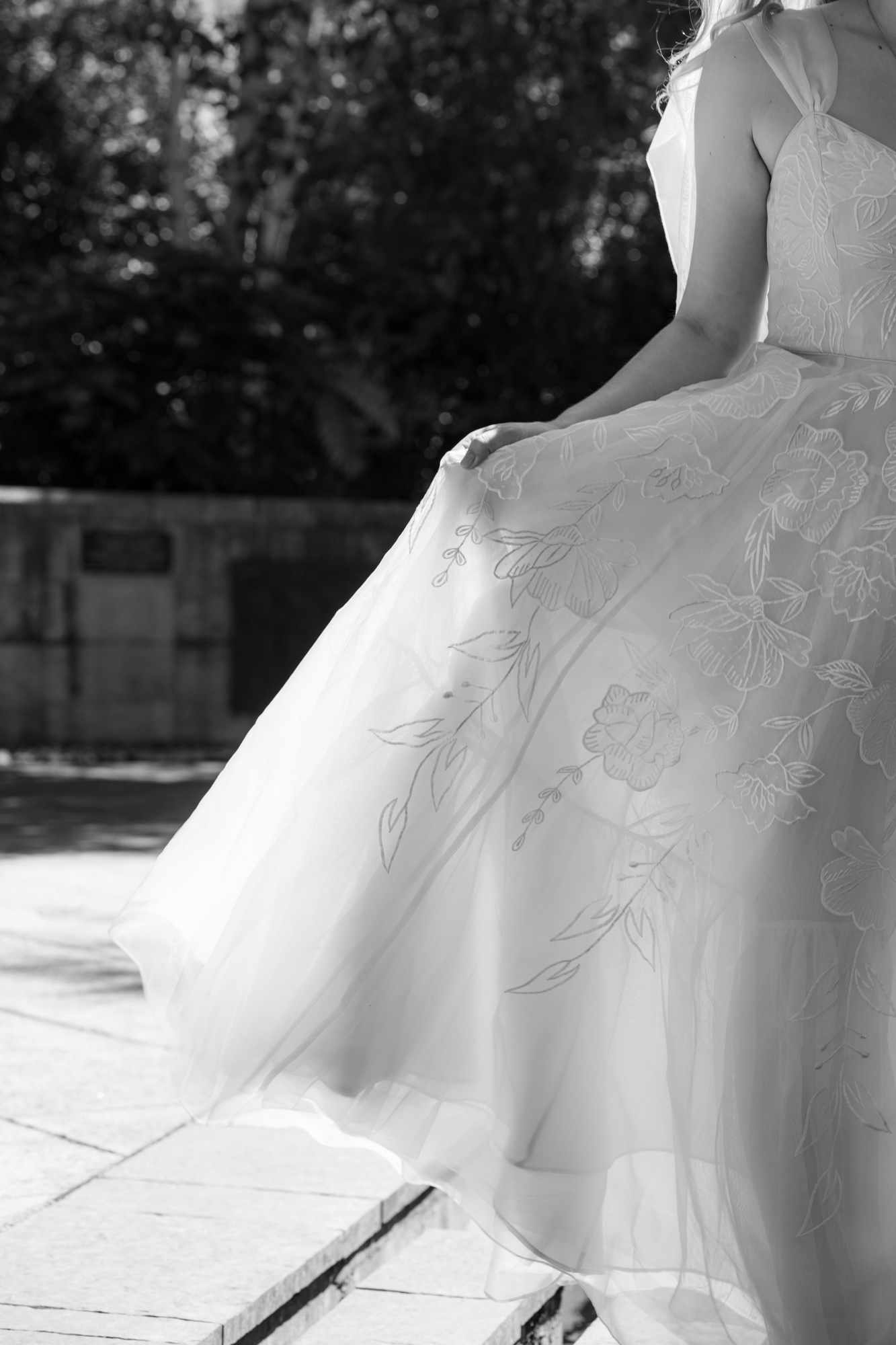 Aberdeen Wedding Photographer: Black and white photo of sunlight shining through a white wedding dress at a Duthie Park Winter Gardens wedding.