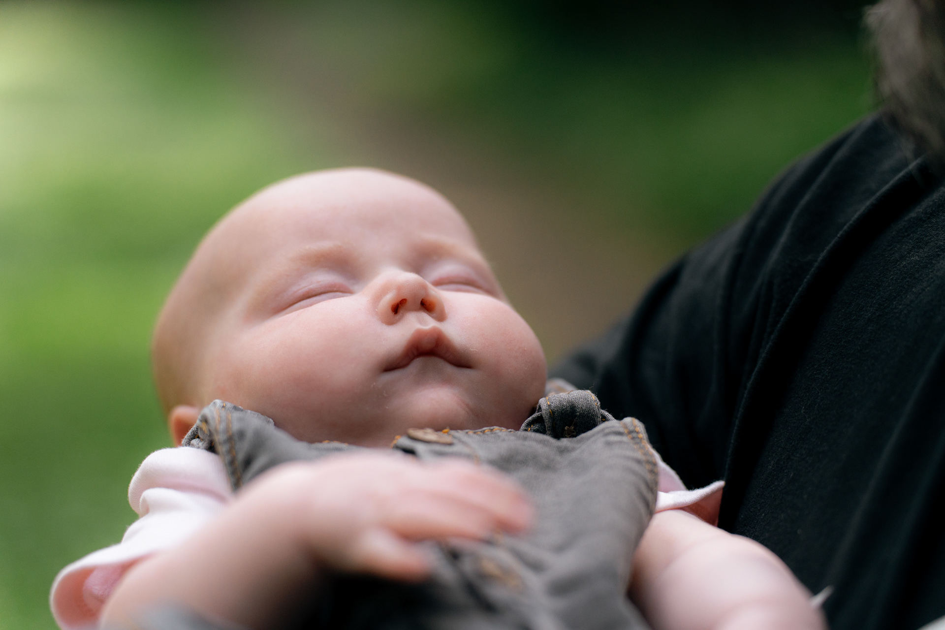 A close up of newborn baby's sleeping face at her Aberdeen family photo shoot.