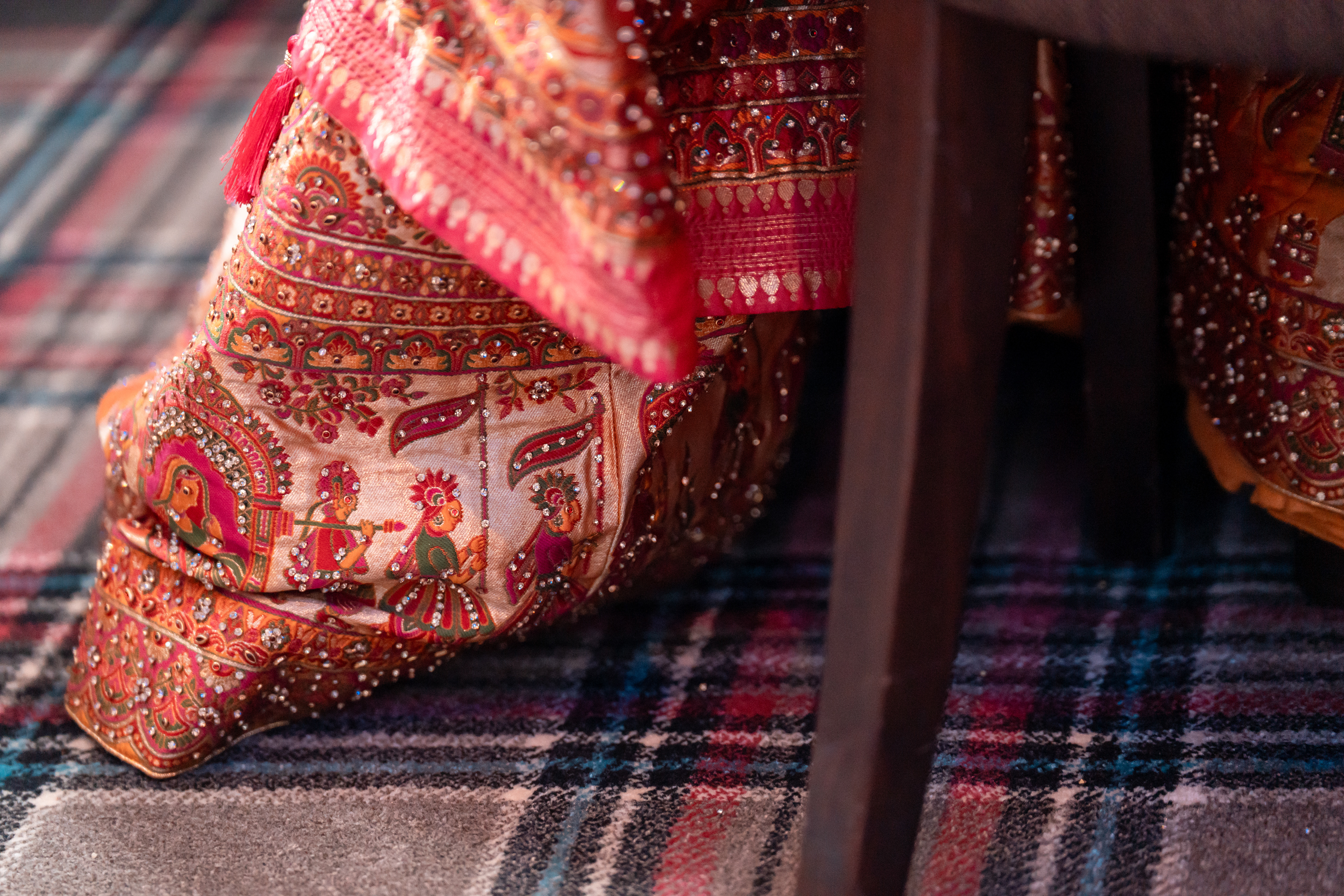 Detail shot of the bride's beautiful beaded red and orange wedding dress. Taken at a Marischal College micro-wedding.