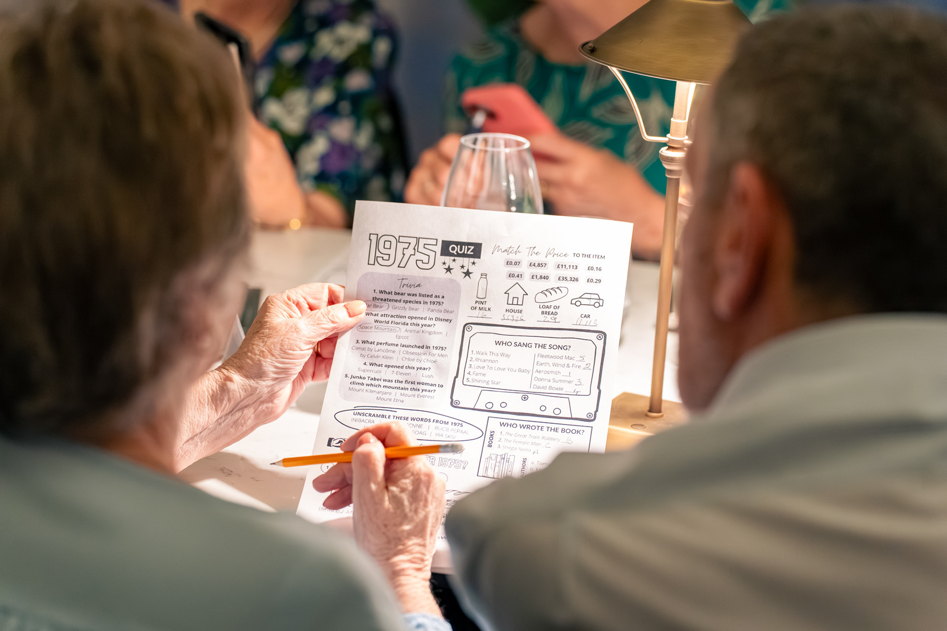 A 1975 quiz is shown, held in somebody's hand.