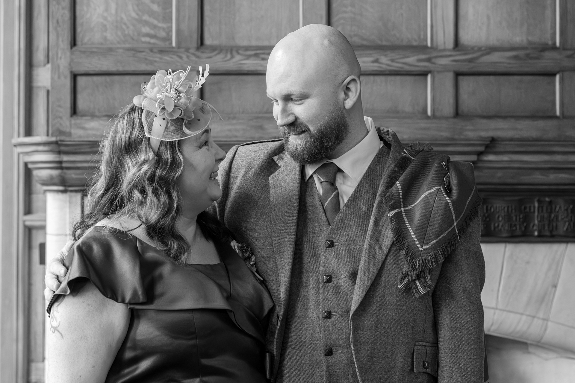 Groom and his mother hug and beam at each other during an Aberdeen registry office wedding.