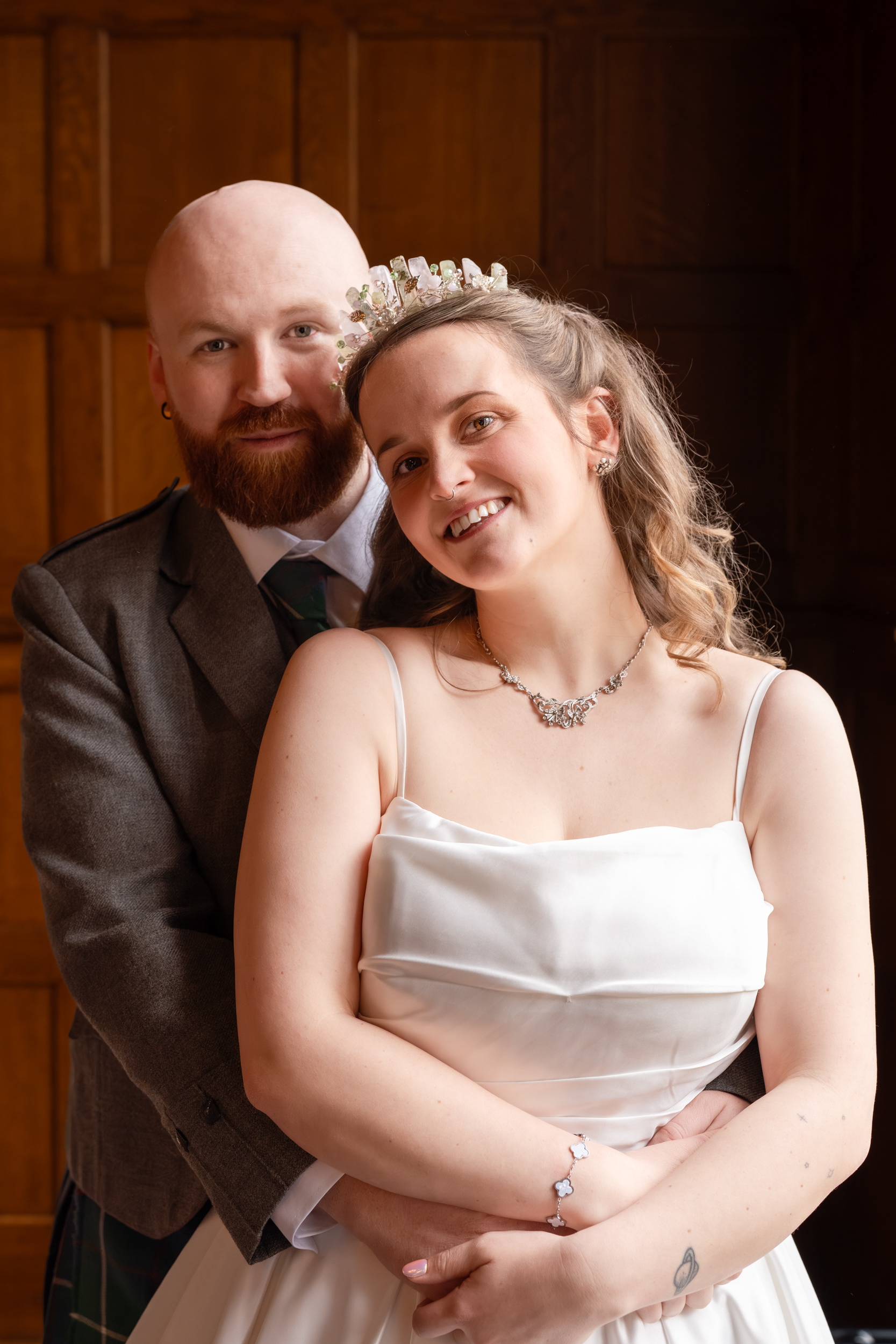 Aberdeen wedding photography: Portrait of bride and groom, side lit by window.