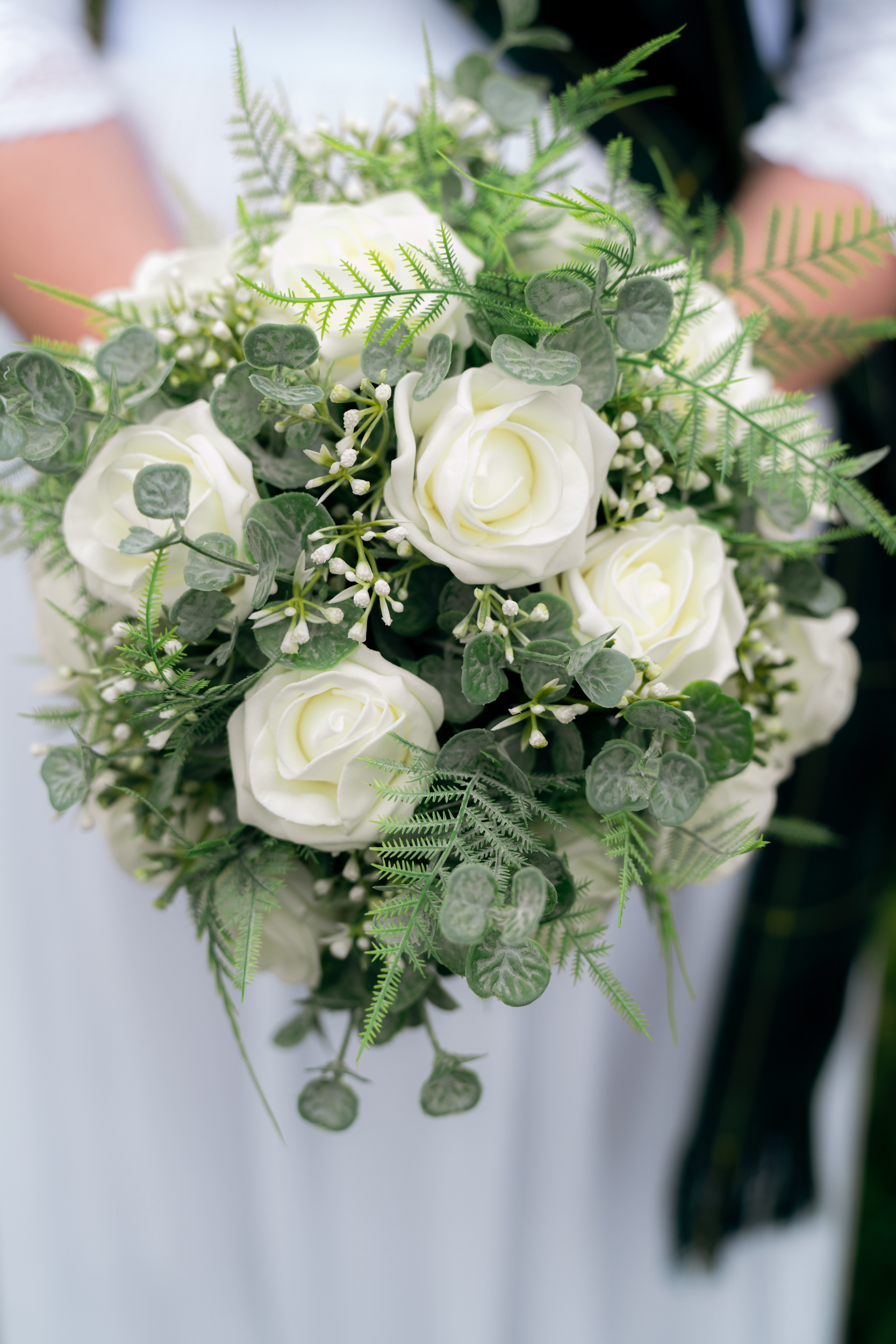 Alternative Aberdeen wedding photographer: Close up of bride's bouquet of white roses.