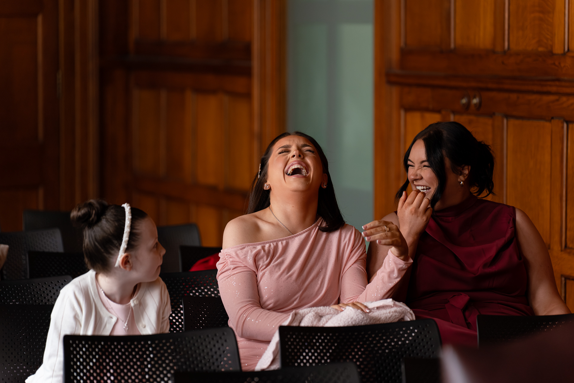 Guests laughing at a Marischal College wedding.