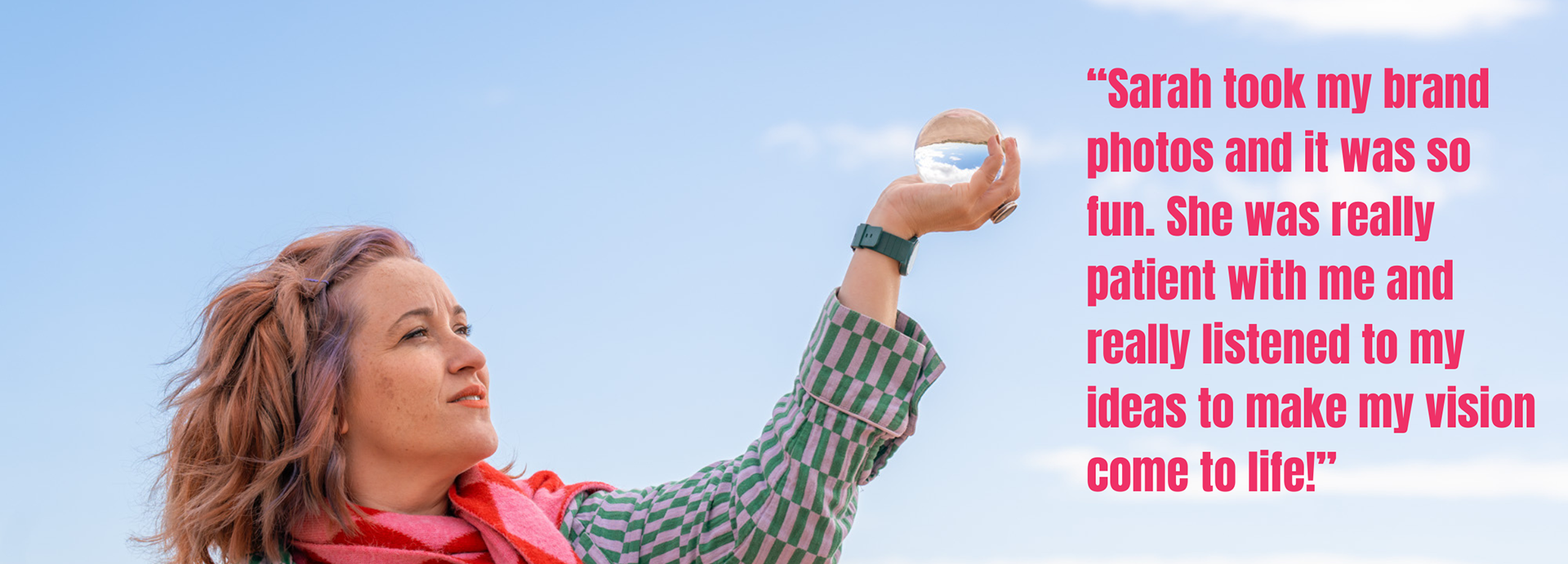 A woman with purple and ginger hair, wearing a pink and red scarf, holds a crystal ball up to the blue sky. The overlaid Aberdeen branding photographer review reads: "Sarah took my brand photos and it was so fun. She was really patient with me and really listened to my ideas to make my vision come to life!"