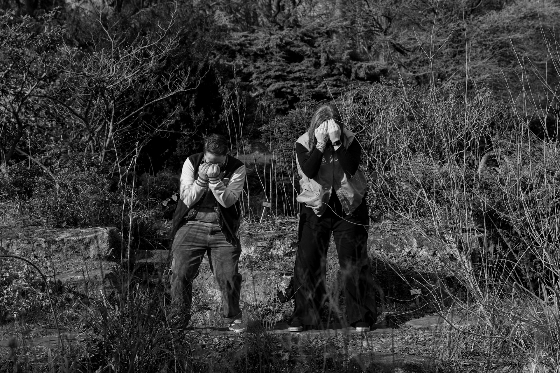 During an Aberdeen queer couple's photo shoot, two people mess around, hiding their faces and dancing