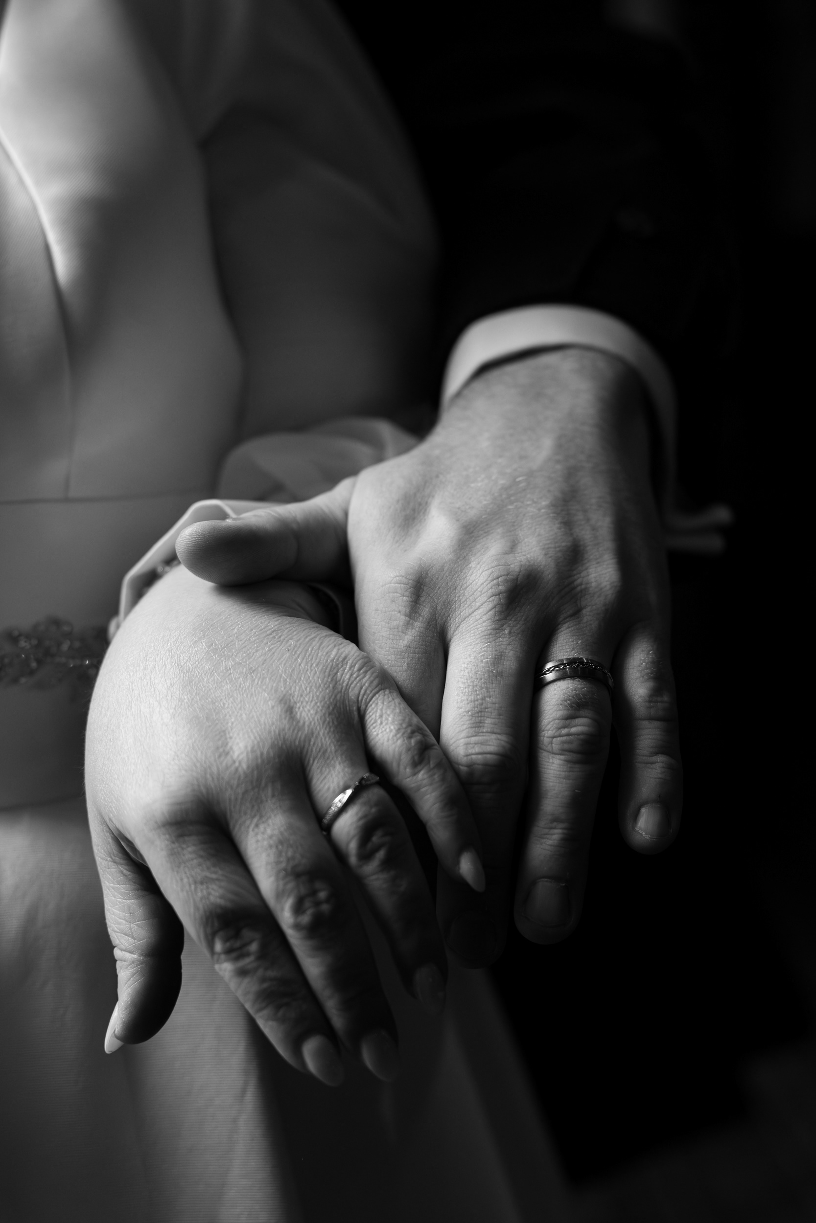 Aberdeen registry office wedding: Black and white photo of couple's hands with new wedding rings visible.