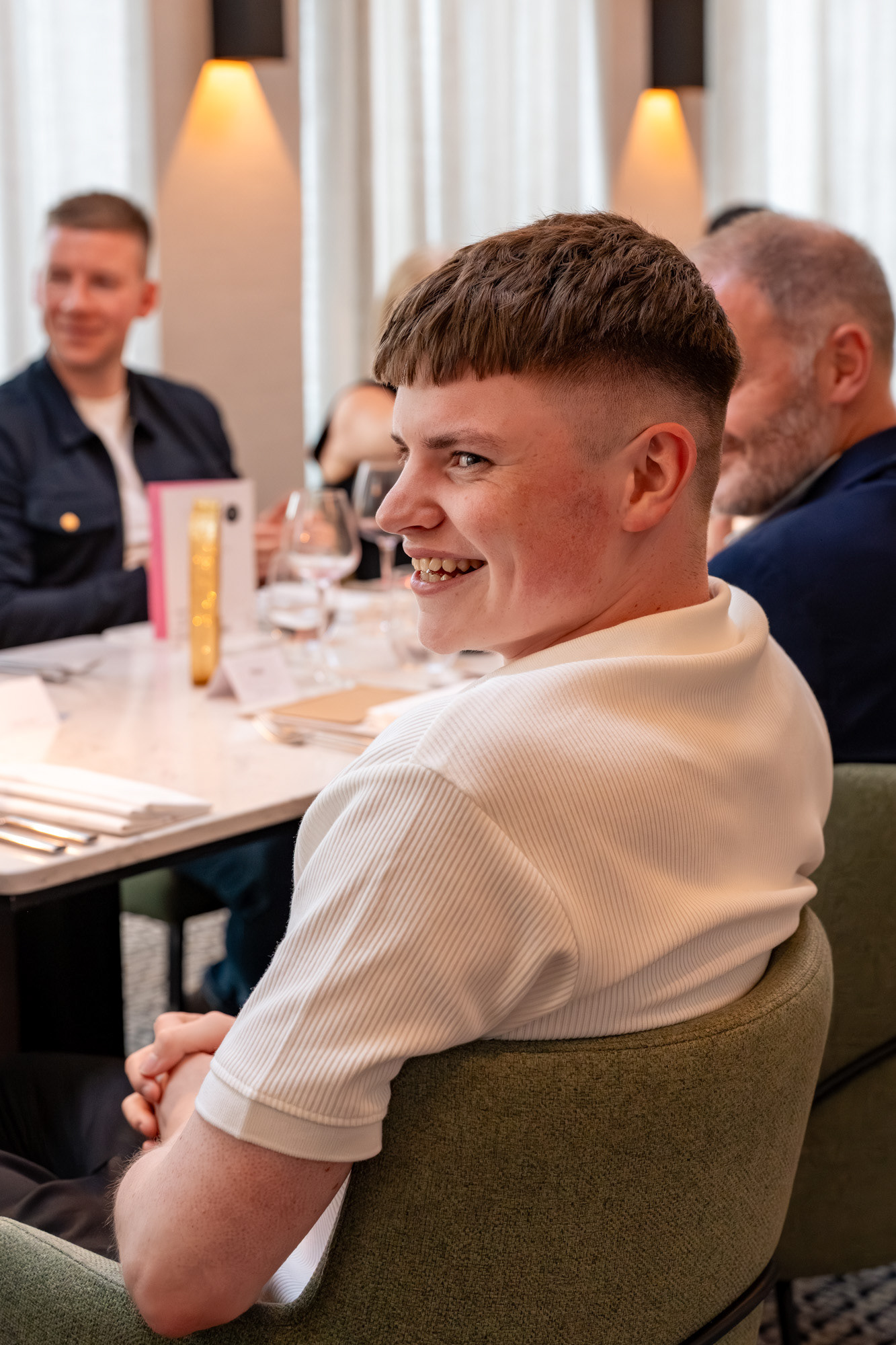 Aberdeen Party Photography: A young man in a white polo shirt laughs.