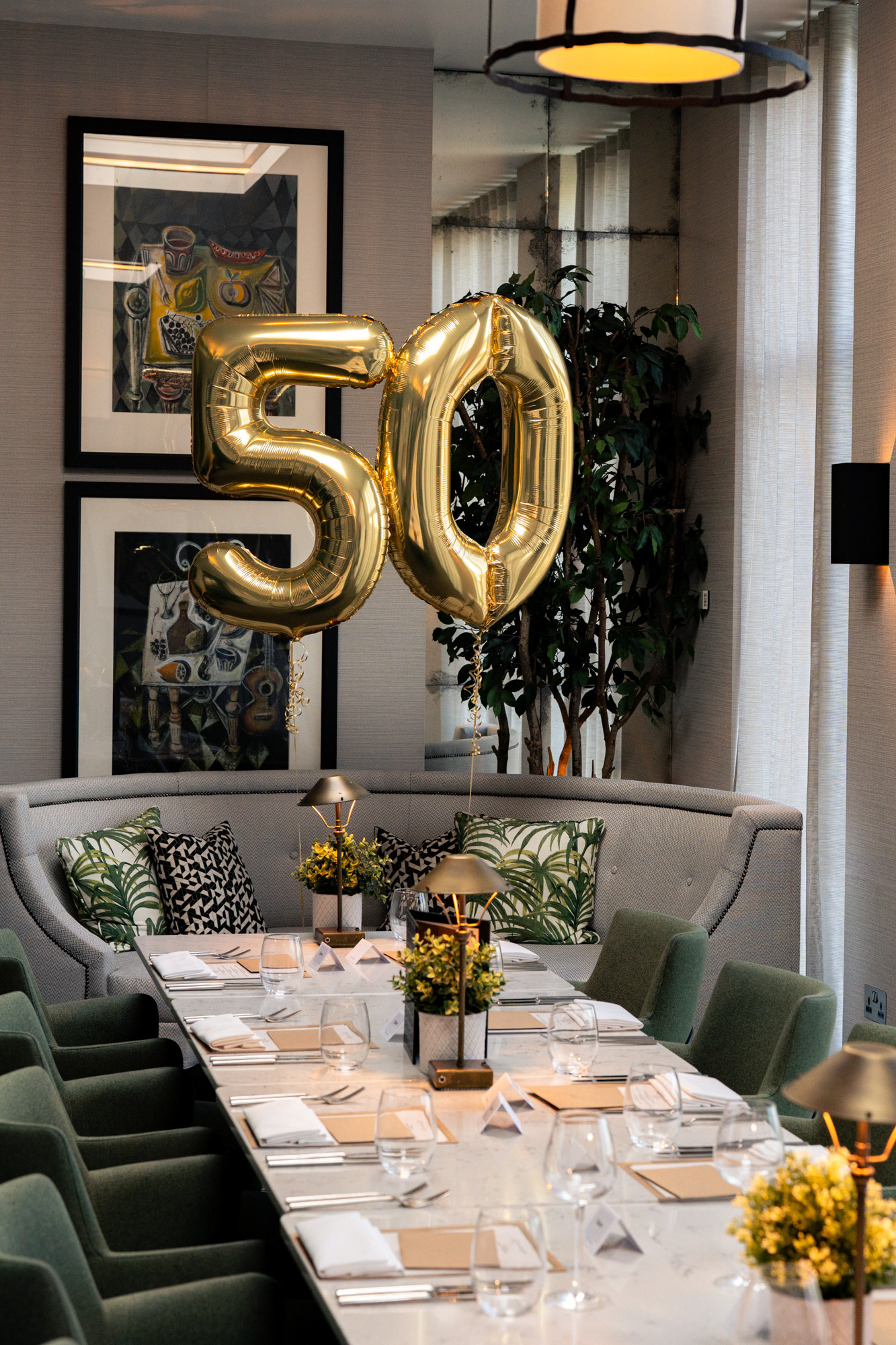 Party Photography Aberdeen: Gold 50 balloons bob above a table laid for a birthday dinner in the Chester Hotel's Garden Room.