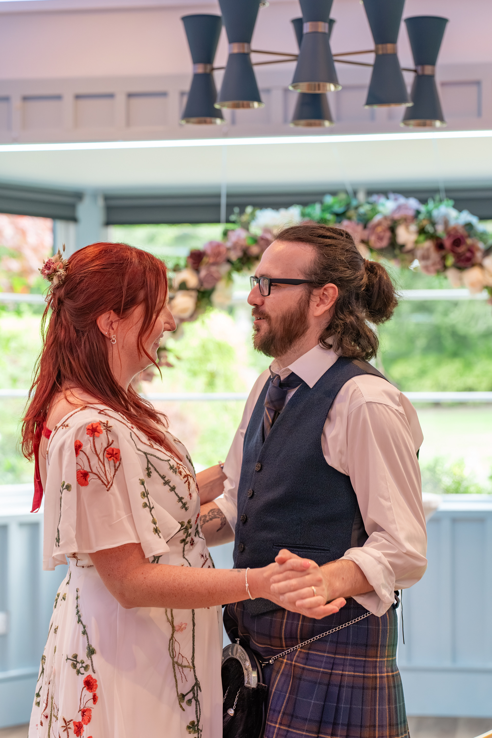 Bride and groom share their first dance during their reception at Hazlehead Park Cafe