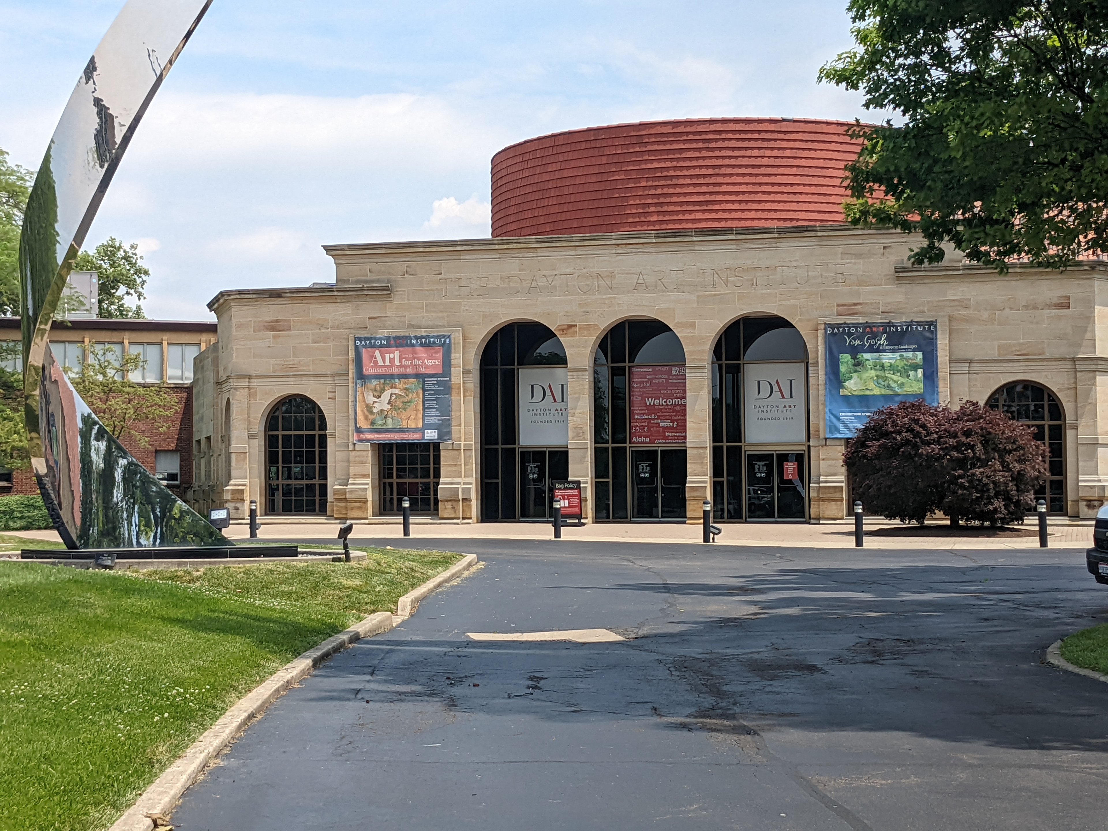 View of Entrance Rotunda with banners for Art for the Ages and a smaller, focus exhibition: Van Gogh & European Landscapes. All banners, including the logo and welcome signs above the doors, as well as the bag policy sign, are all my design.