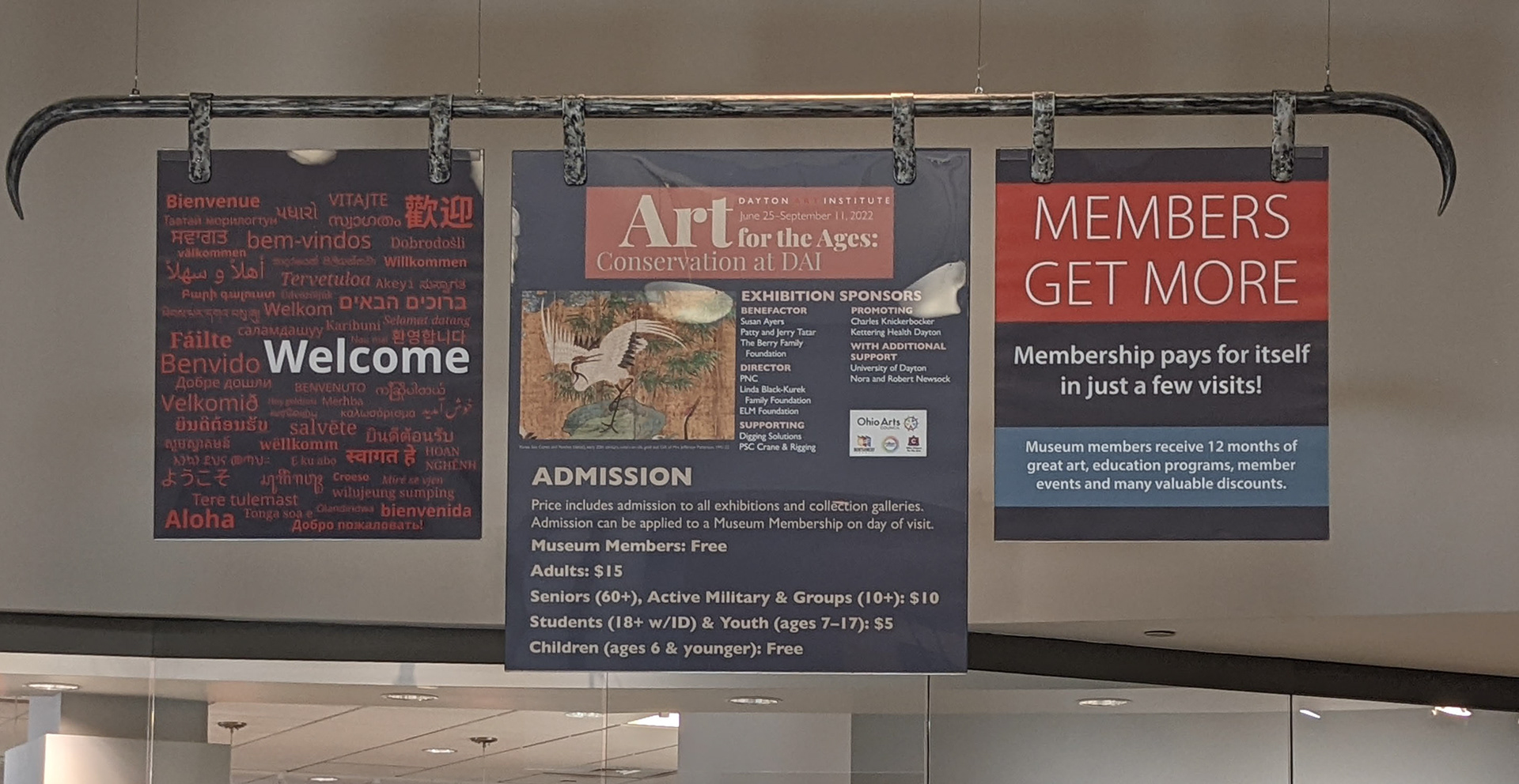 Admission banner above the Guest Services Desk. All banners were designed by me.