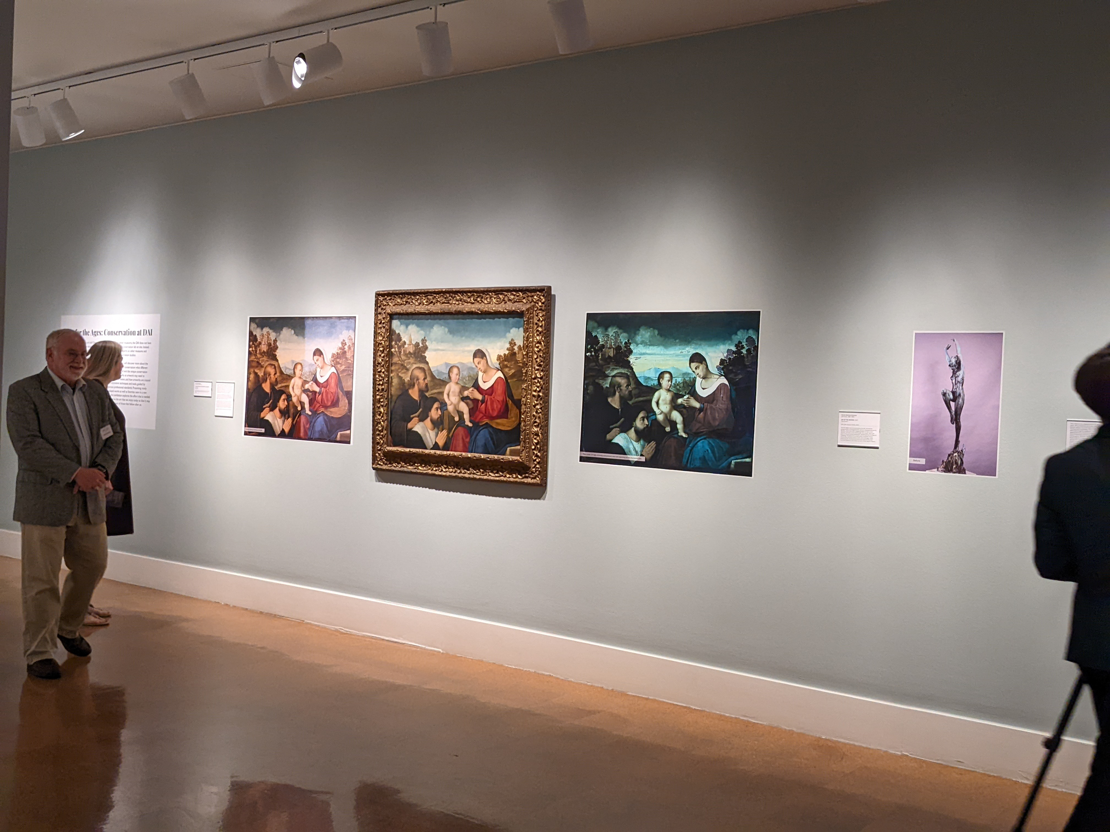 View of art work surrounded by the 'flair' or informational panels detailing the conservation process.