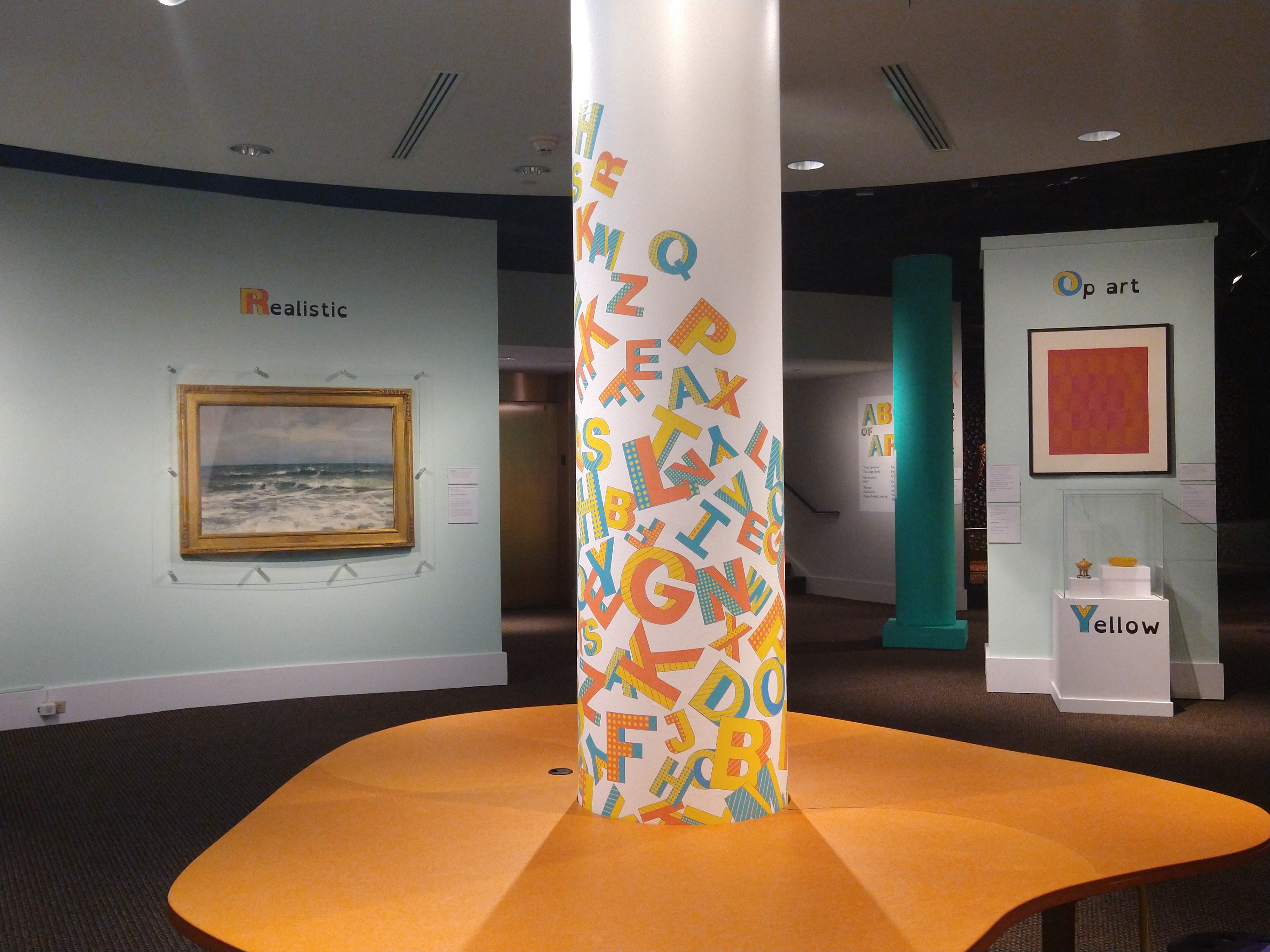 Bespoke alphabet used as a playful column wrap at the activity table.