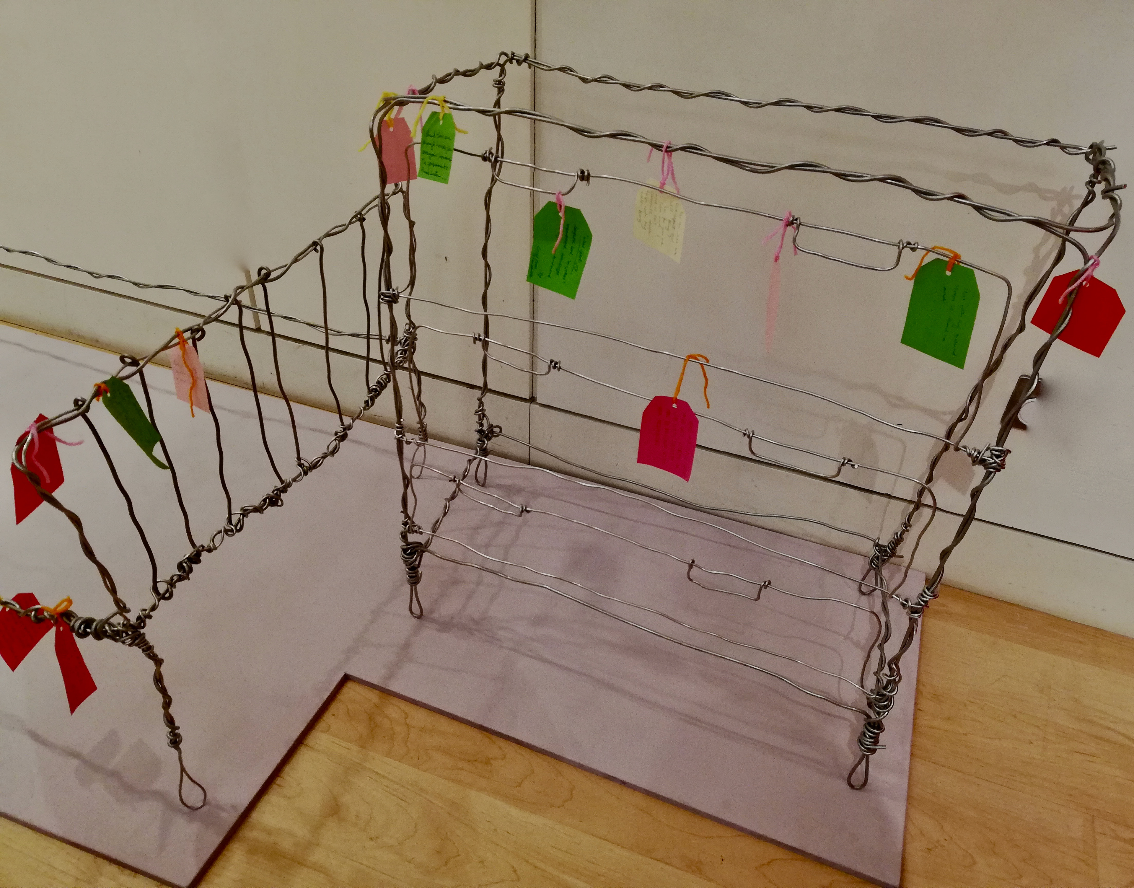 "Make me a Home" Installation with the publics respondes to the questions on tags.