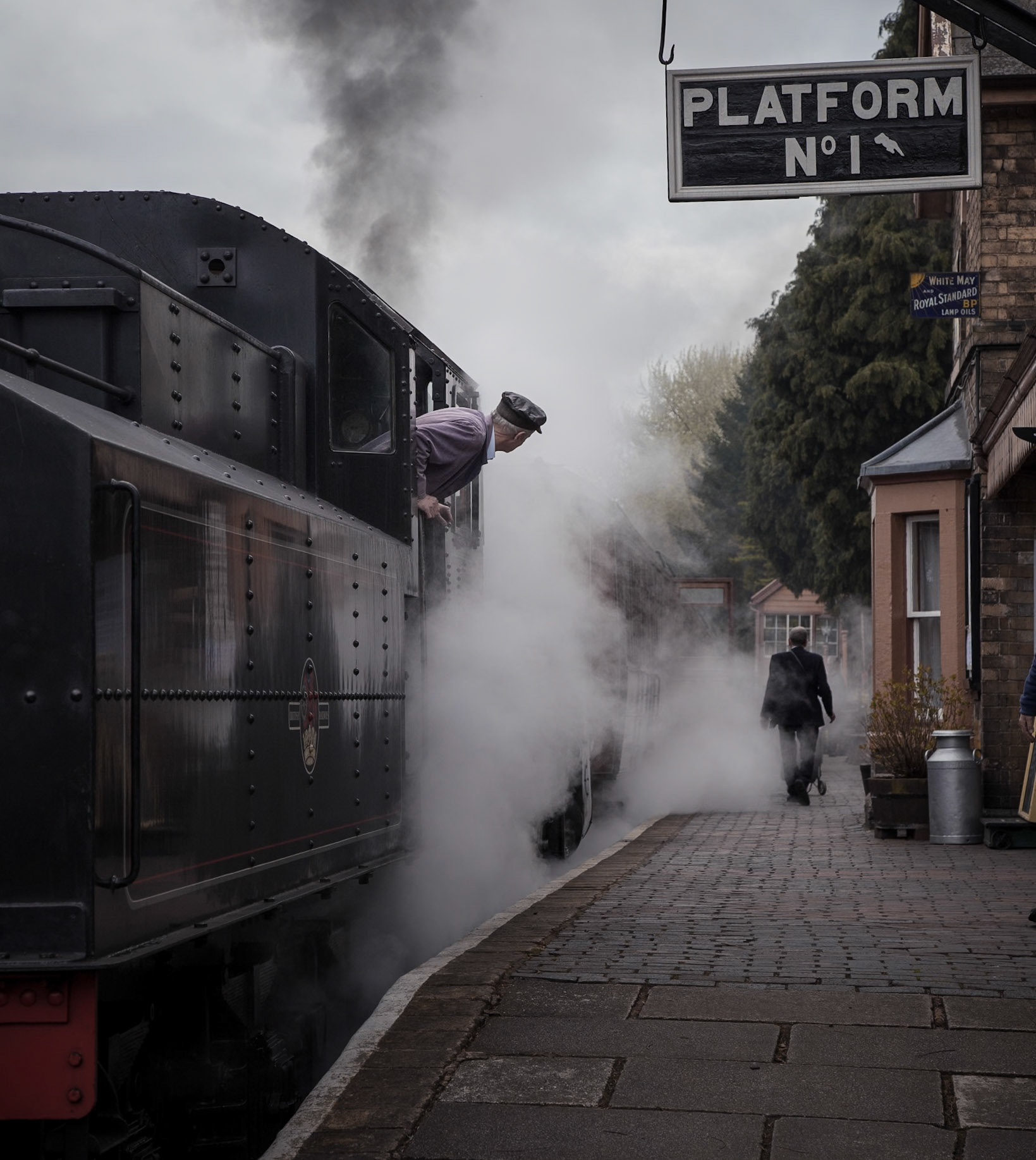 The fireman of the Ivatt Class 4 no. 43106 - the only survivor of a class of 162 locomotives - waits for the guard to check his train before leaving Hampton Loade for Bridgnorth, on the stunning Severn Valley Railway in England's West Midlands.