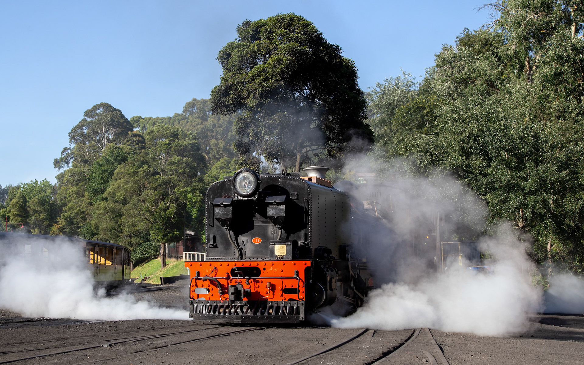 On the morning of its official relaunch into service, NG/G16 129 bakes in the morning summer sun at Belgrave outside the running shed.