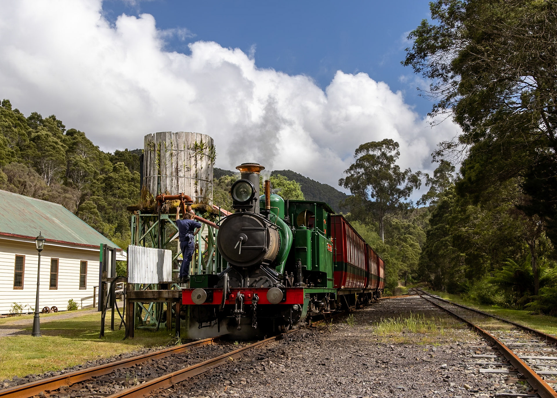 After arriving from Queenstown, Abt locomotive No. 1 takes water at Lynchford before progressing onwards to Rinadeena and Dubbil Barril.