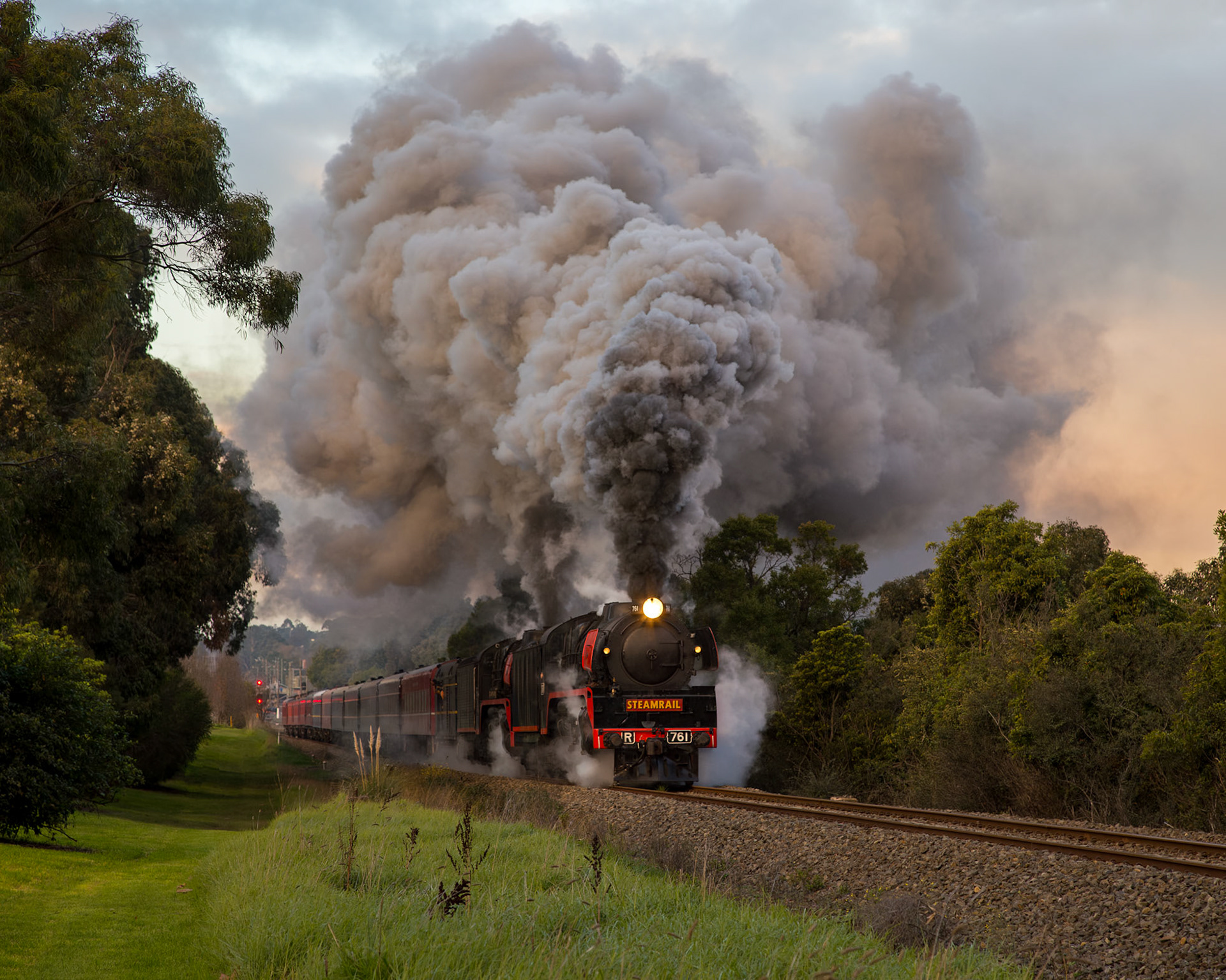Golden hour is upon us as R761 and R707 burst forth from Traralgon station and attack the climb up towards Morwell, returning to Melbourne with one of Steamrail's highly-popular Snow Trains.