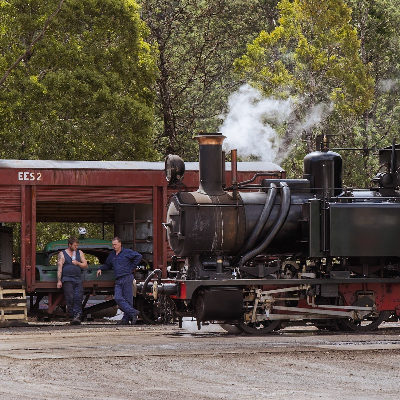 Engineers at WCWR's workshops in Queenstown take a moment in the sun as Abt No. 3 gently simmers away.
