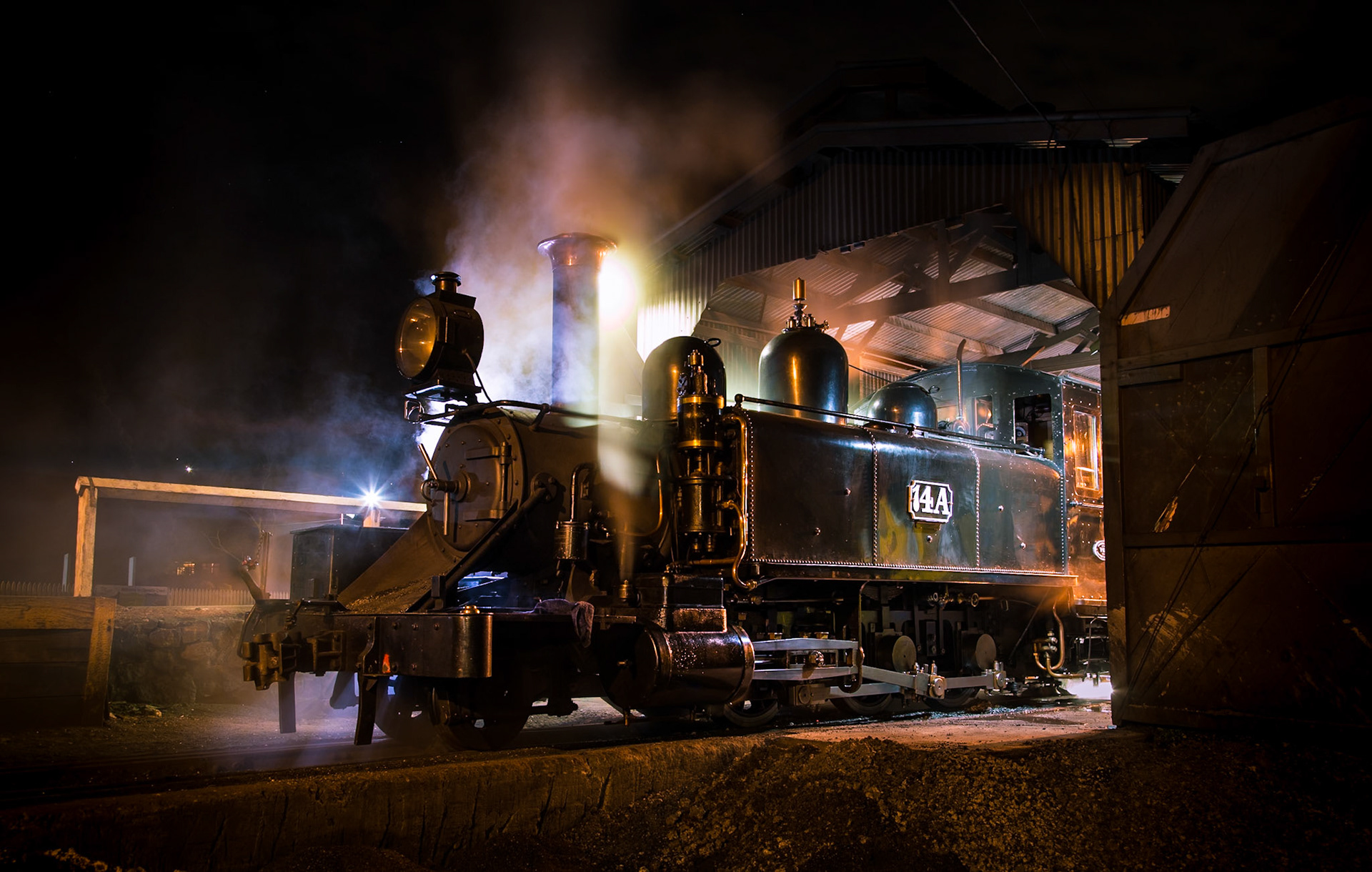 As the fire is dropped on 14A steam and smoke gather in the still night air, shrouding the youngest surviving NA class locomotive. 14A had just returned from Nobelius Siding with one of Puffing Billy Railway's regular dinner trains.