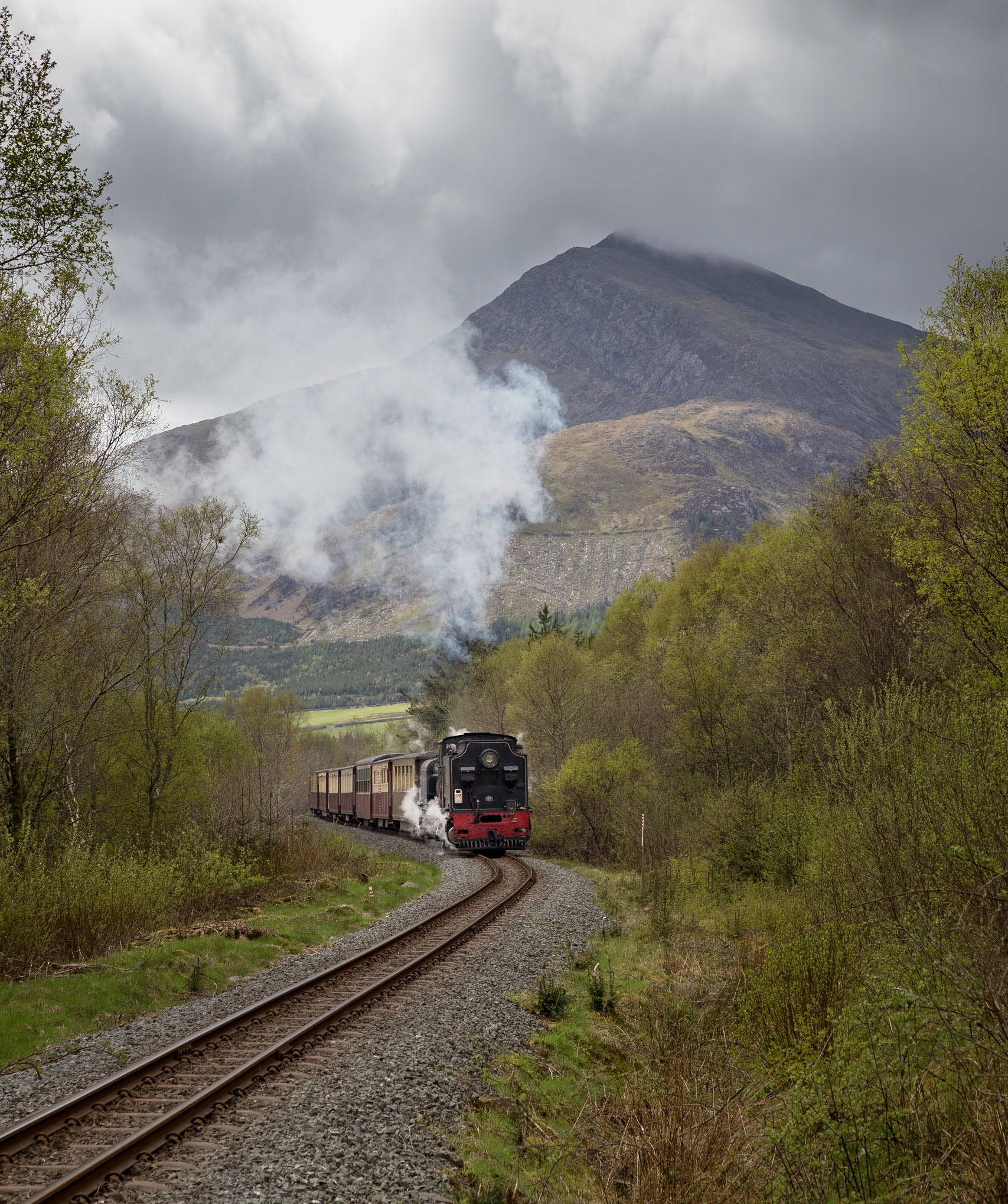 NGG16 no. 87 rumbles uphill from Beddgelert towards Caernarfon on a bitterly cold spring morning as the peak of Moel Hebog disappears into the low cloud.