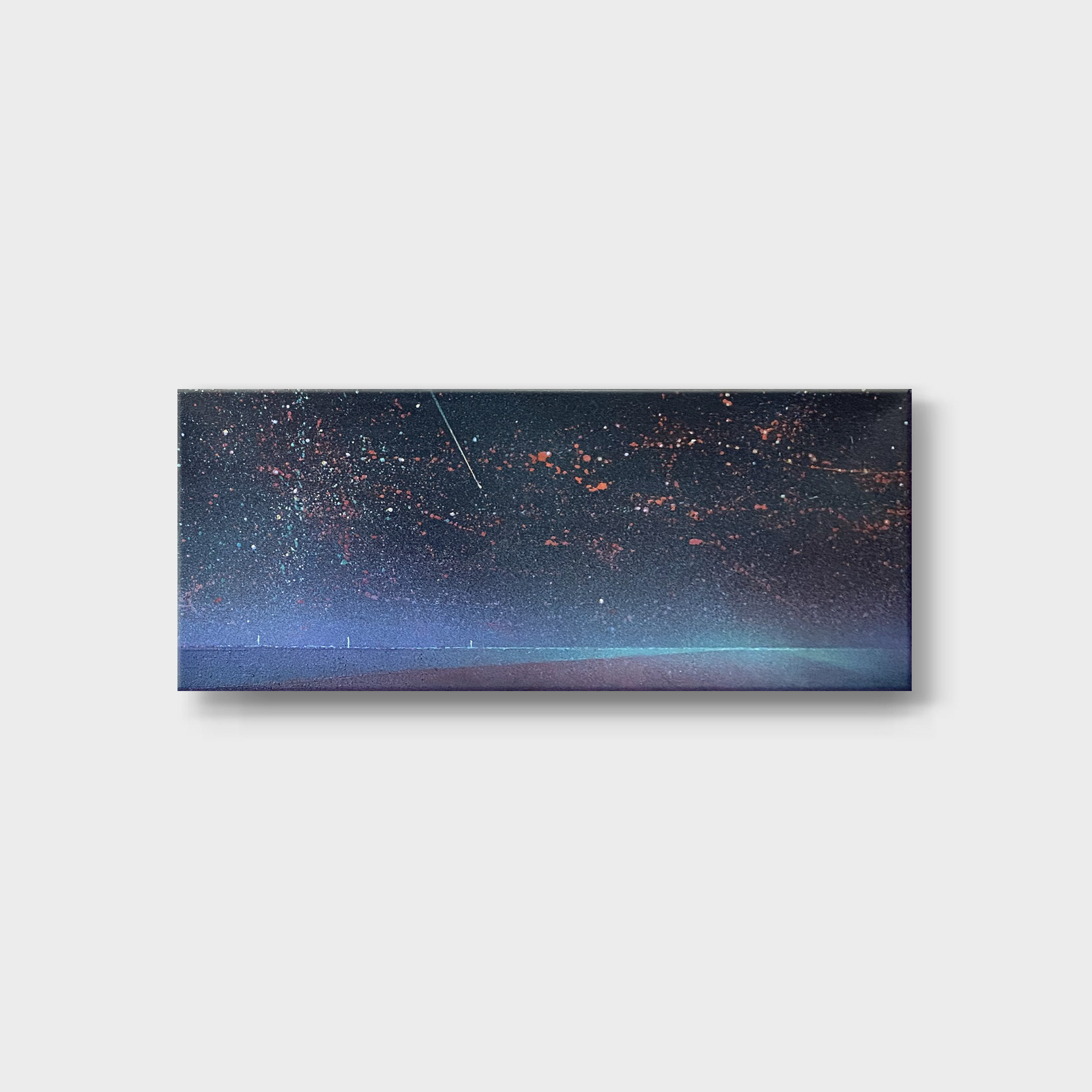 A panoramic fine art painting capturing a vast night landscape with a starlit sky over a dark horizon. The composition is dominated by deep navy blue, violet, and black tones, covered in a dense nebula of tiny white and copper paint splatters. A sharp, diagonal white line creates the effect of a shooting star or meteor streaking across the sky. Along the lower edge, a subtle, luminous line represents a lonely road with minimalist vertical poles on the left.