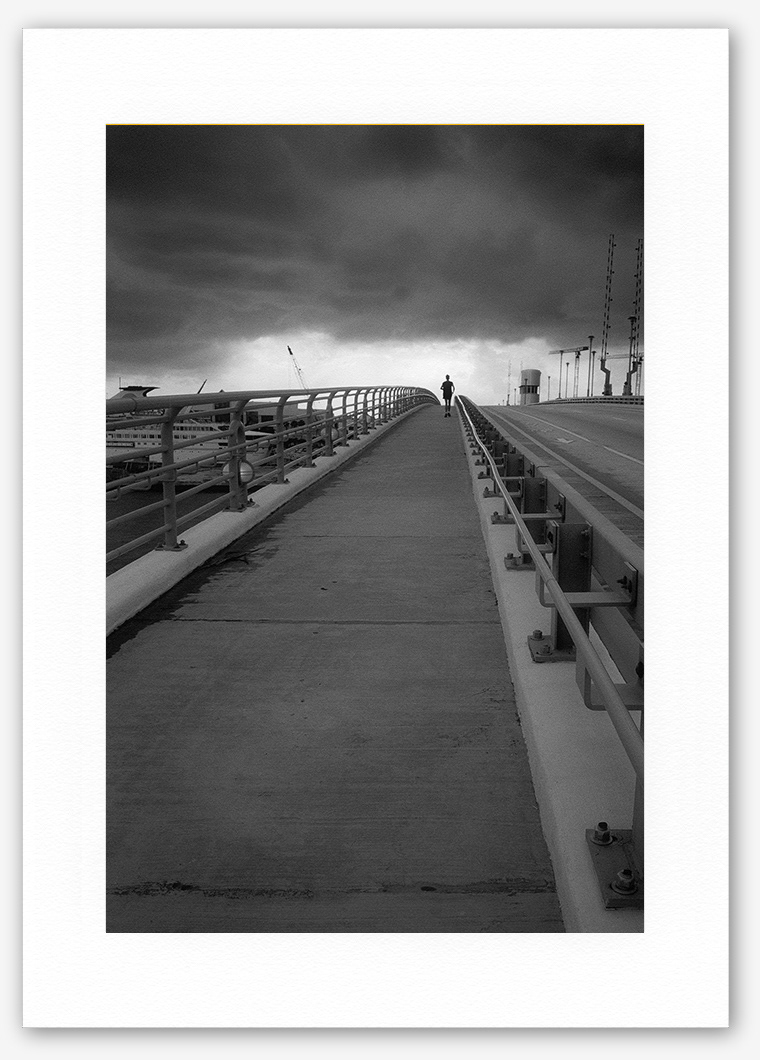 Steve Hanson photography. Jogger and storm, Florida, USA.