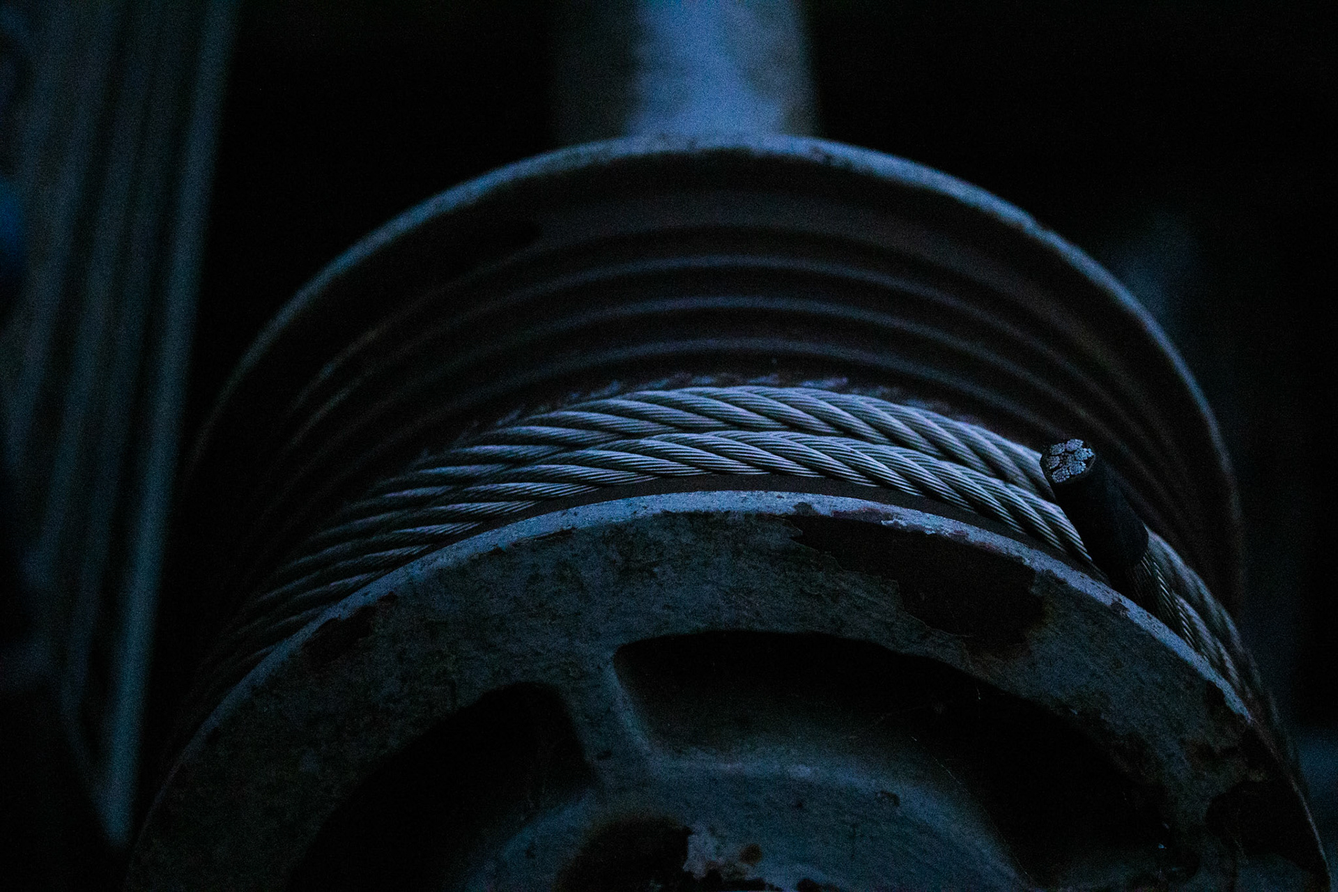 A spool of cable over a weir