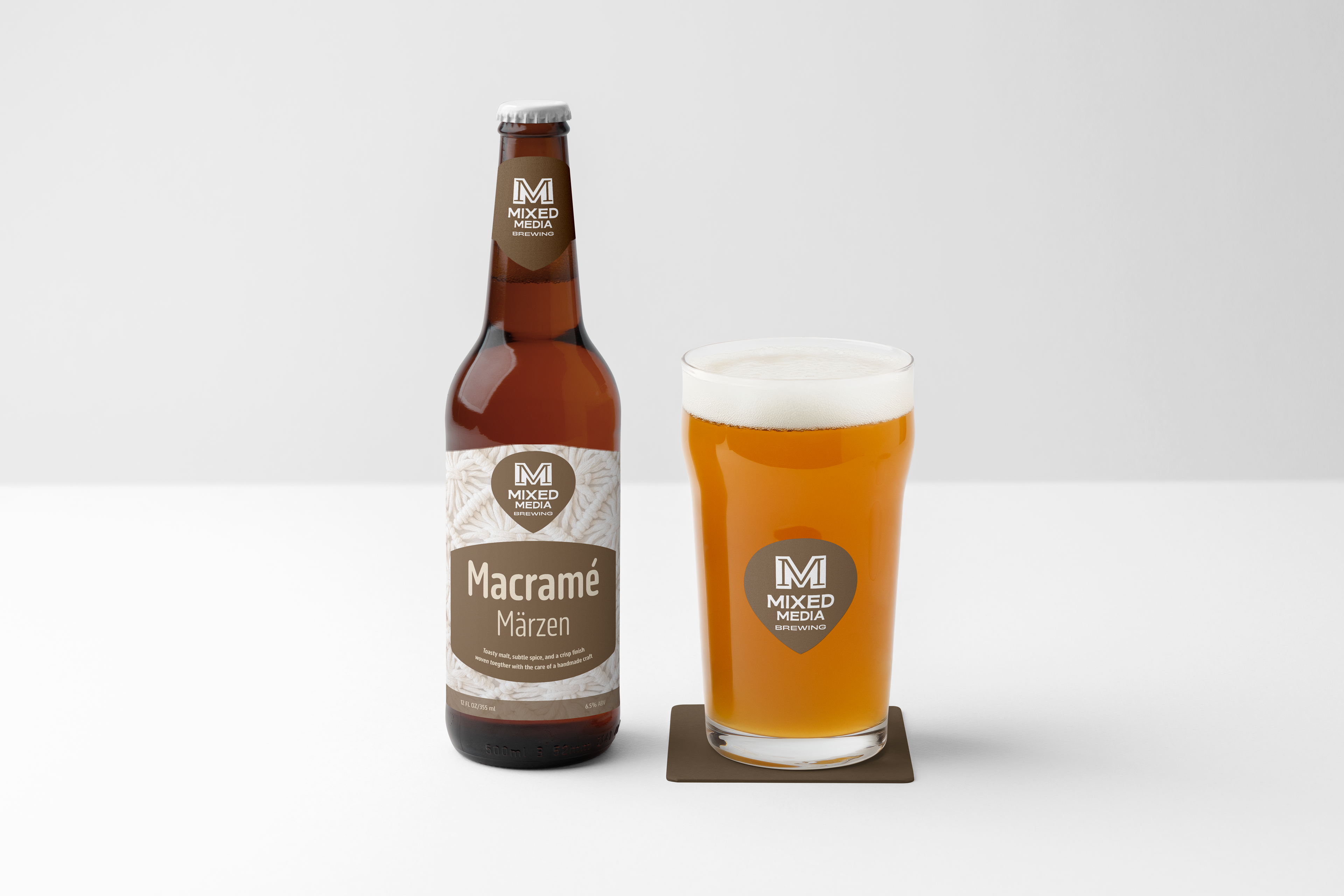Macramé Märzen bottle and branded pint glass on a white background.