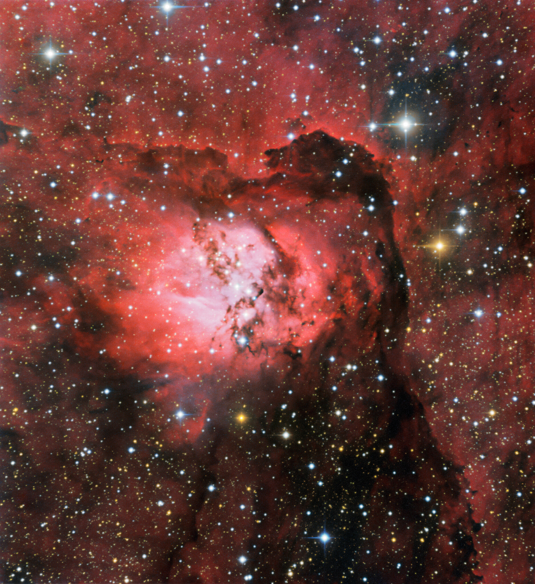 The emission nebula Sh2-54 glows brightly in this image from the SMARTS 0.9-meter Telescope at Cerro Tololo Inter-American Observatory, a Program of NSF’s NOIRLab. Gathering the fine details of this particular image required almost twenty minutes of observations and three different wavelength filters. Situated within the constellation of Serpens (The Serpent), Sh2-54 forms part of a much wider nebulosity which includes the famous Eagle Nebula. Serpens is a unique constellation, the only one of the official 88 used today that is split into two unconnected parts: Serpens Caput — the Serpent’s Head — and Serpens Cauda — The Serpent’s Tail.   Credit: CTIO/NOIRLab/NSF/AURA Acknowledgment: Image processing: Travis Rector (University of Alaska Anchorage), Mahdi Zamani & Davide de Martin