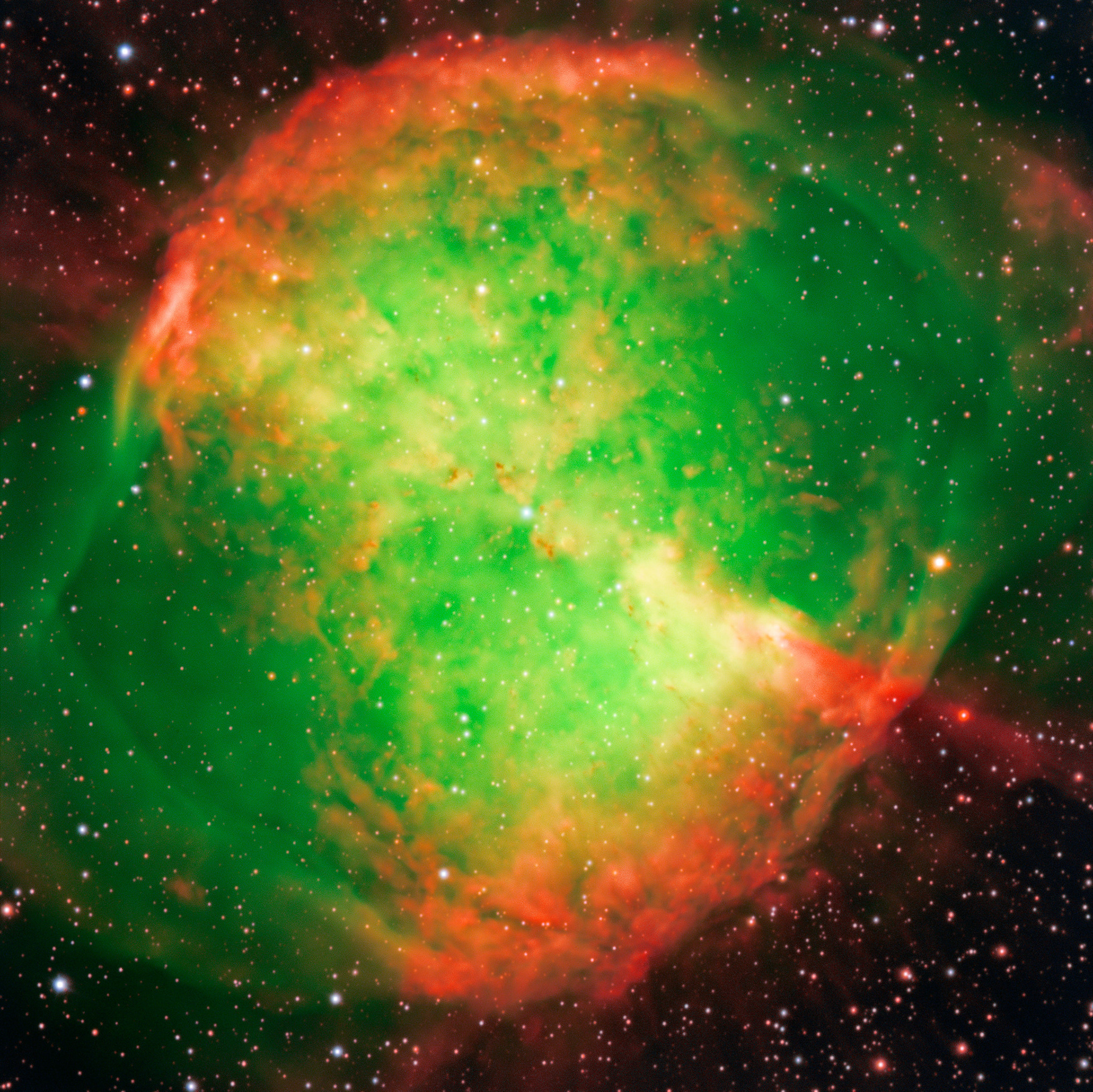 The Dumbbell Nebula ­— also known as Messier 27 or NGC 6853 — is a typical planetary nebula and is located in the constellation Vulpecula (The Fox). The distance is rather uncertain, but is believed to be around 1,200 light-years. It was first described by the French astronomer and comet hunter Charles Messier who found it in 1764 and included it as no. 27 in his famous list of extended sky objects [2] .Despite its class, the Dumbbell Nebula has nothing to do with planets. It consists of very rarified gas that has been ejected from the hot central star (well visible on this photo), now in one of the last evolutionary stages. The gas atoms in the nebula are excited (heated) by the intense ultraviolet radiation from this star and emit strongly at specific wavelengths.  This image is the beautiful by-product of a technical test of some FORS1 narrow-band optical interference filtres. They only allow light in a small wavelength range to pass and are used to isolate emissions from particular atoms and ions. In this three-colour composite, a short exposure was first made through a wide-band filtre registering blue light from the nebula. It was then combined with exposures through two interference filtres in the light of double-ionized oxygen atoms and atomic hydrogen. They were colour-coded as “blue”, “green” and “red”, respectively, and then combined to produce this picture that shows the structure of the nebula in “approximately true” colours.  They are three-colour composite based on two interference ([OIII] at 501 nm and 6 nm FWHM — 5 min exposure time; H-alpha at 656 nm and 6 nm FWHM — 5 min) and one broadband (Bessell B at 429 nm and 88 nm FWHM; 30 sec) filtre images, obtained on September 28, 1998, during mediocre seeing conditions (0.8 arcsec). The CCD camera has 2048 x 2048 pixels, each covering 24 x 24 µm and the sky fields shown measure 6.8 x 6.8 arcminutes and 3.5 x 3.9 arcminutes, respectively. North is up; East is left.  Credit: ESO/I. Appenzeller, W. Seifert, O. Stahl, M. Zamani