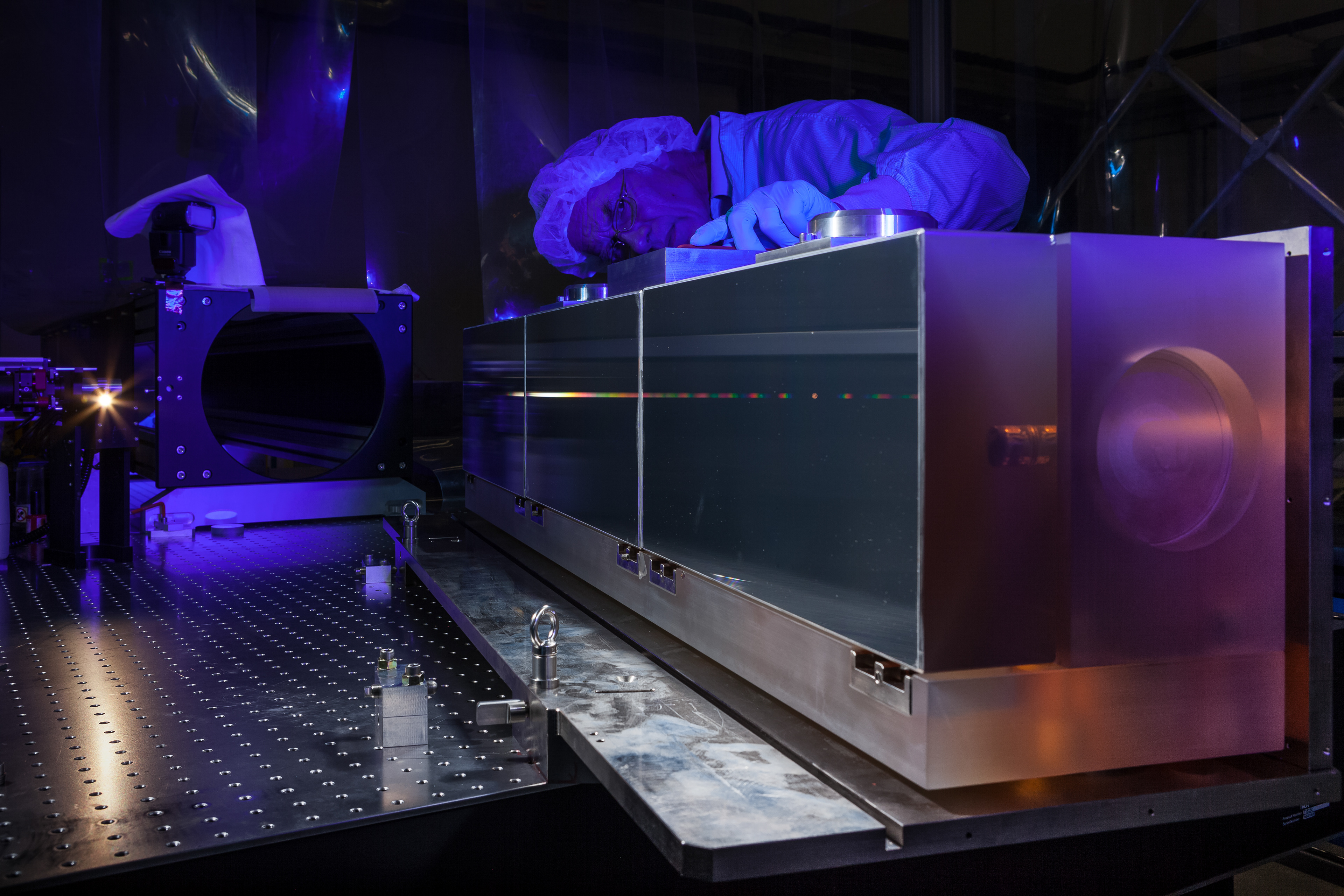 The huge diffraction grating at the heart of the ultra-precise ESPRESSO spectrograph — the next generation in exoplanet detection technology — is pictured undergoing testing in the cleanroom at ESO Headquarters in Garching bei München, Germany.