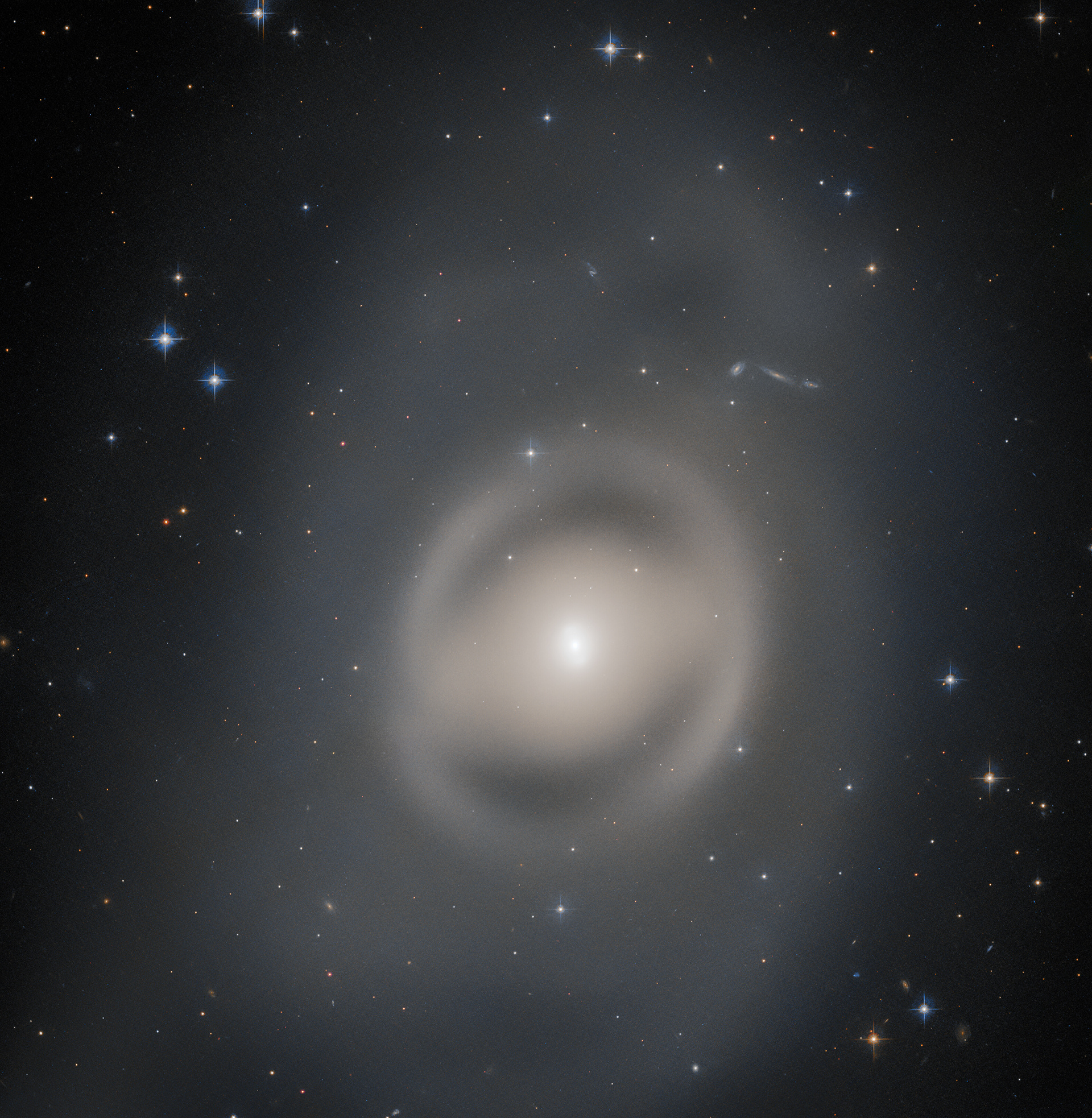 Portrait of a Ghostly Galactic Peacock - Credit: ESA/Hubble & NASA, R. Tully