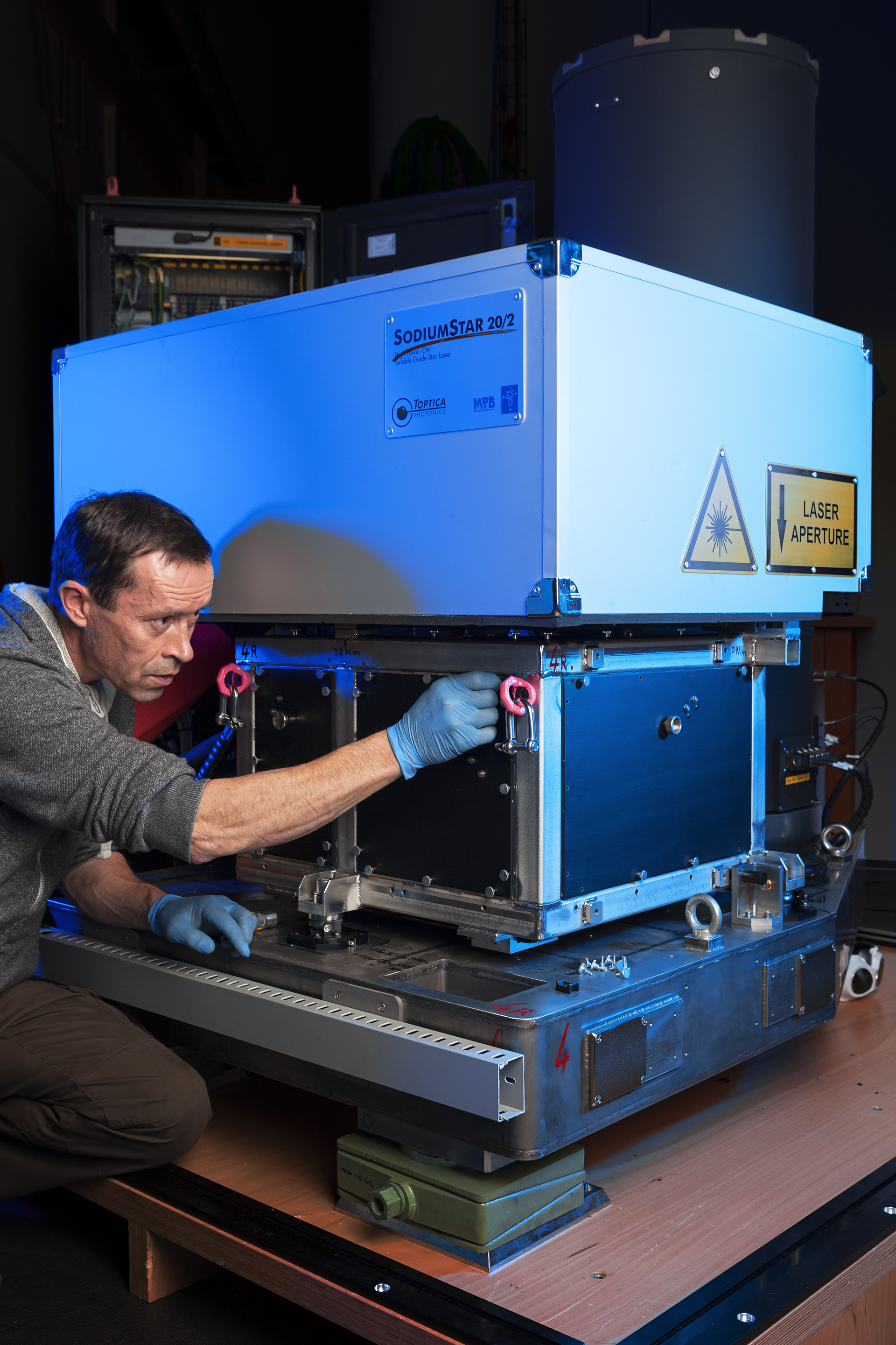 All four laser units that form the Four Laser Guide Star Facility — a core part of the Adaptive Optics Facility for ESO’s Very Large Telescope — were accepted by ESO and shipped to Chile in November 2015. This is a major step towards establishing the VLT Unit Telescope 4 as a fully adaptive telescope with much enhanced image quality.  This picture shows one of the units undergoing final testing by Christophe Dupuy, Integration hall manager, shortly before it was packed for shipping.