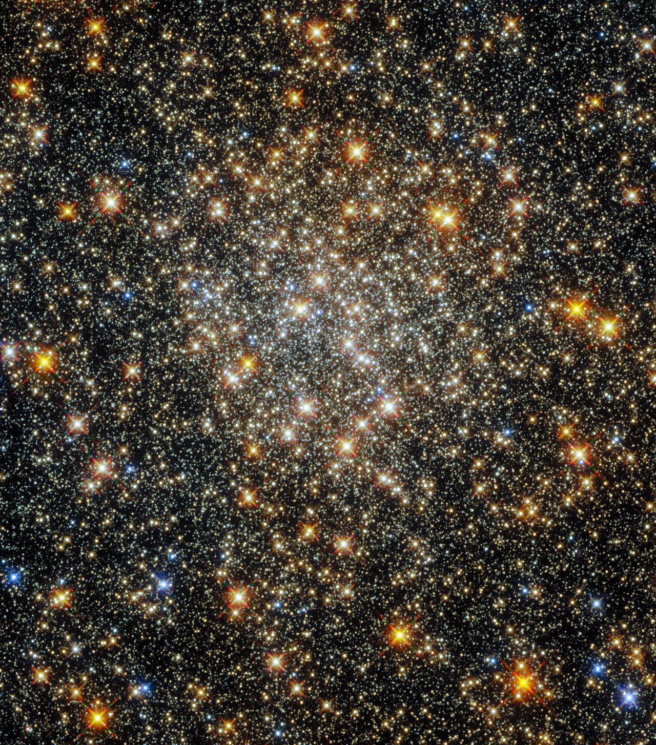 This sparkling starfield, captured by the NASA/ESA Hubble Space Telescope’s Wide Field Camera 3 and Advanced Camera for Surveys, contains the globular cluster ESO 520-21 (also known as Palomar 6). A densely packed, roughly spherical collection of stars, it lies close to the centre of the Milky Way, where interstellar gas and dust absorb starlight and make observations more challenging.   This absorption by interstellar material affects some wavelengths of light more than others, changing the colours of astronomical objects and causing them to appear redder than they actually are. Astronomers call this process “reddening”, and it makes determining the properties of globular clusters close to the galactic centre — such as ESO 520-21 — particularly difficult.  ESO 520-21 lies in the constellation Ophiuchus, near the celestial equator. Ophiuchus was one of the 48 constellations which appeared in the writings of the second-century Egyptian astronomer Ptolemy, all of which are among the 88 constellations officially recognised by the International Astronomical Union today. Not all the constellations proposed by astronomers throughout history have survived, however — forgotten or obsolete constellations include Felis (the Cat), Rangifer (the Reindeer), and even Officina Typographica (the Printer’s Workshop).  Links Video On Clusters and Constellations Credit: ESA/Hubble and NASA, R. Cohen