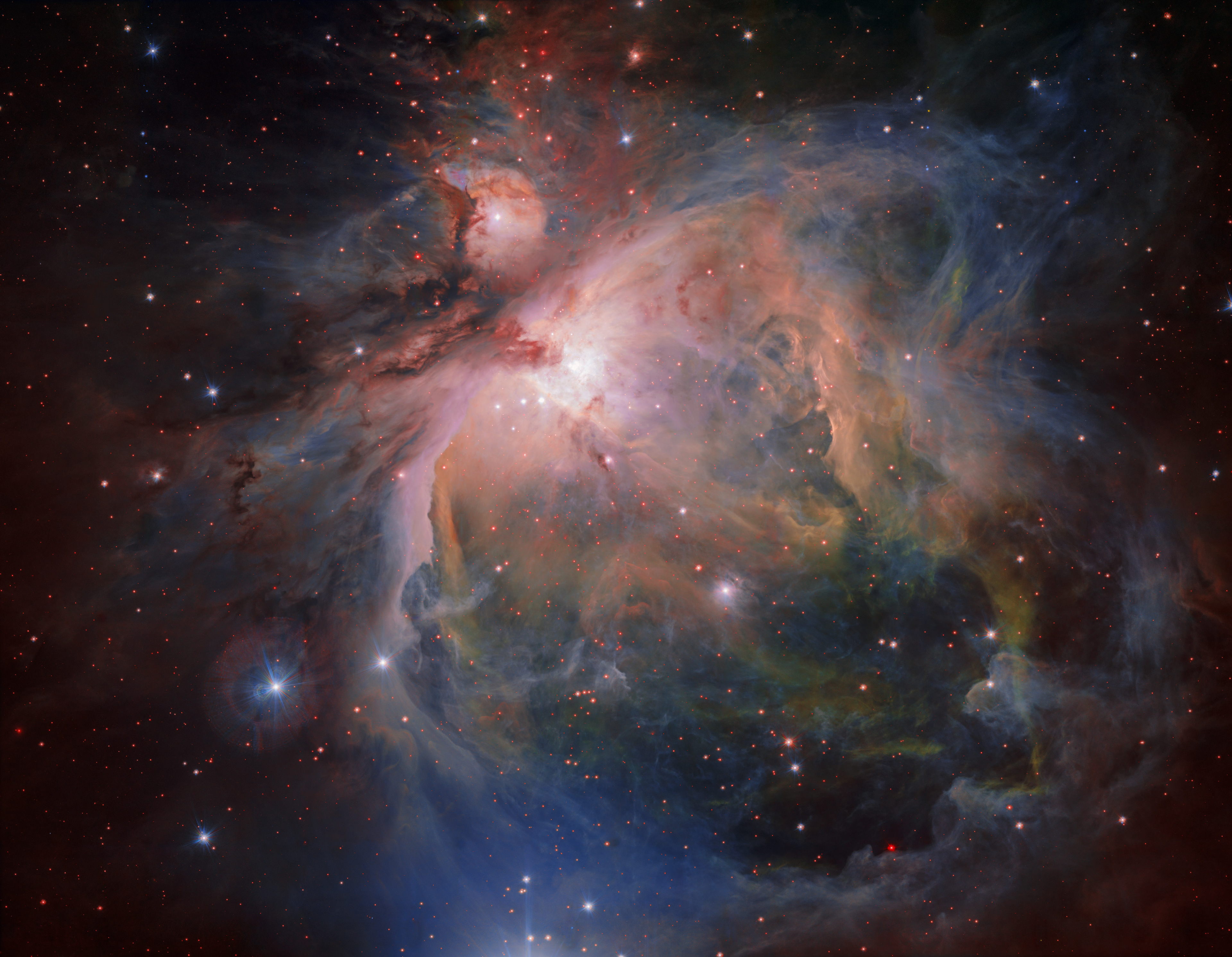 The Orion Nebula and cluster from the VLT Survey Telescope OmegaCAM — the wide-field optical camera on ESO’s VLT Survey Telescope (VST) — has captured the spectacular Orion Nebula and its associated cluster of young stars in great detail,  producing this beautiful new image. This famous object, the birthplace of many massive stars, is one of the closest stellar nurseries, at a distance of about 1350 light-years.  Credit: ESO/G. Beccari